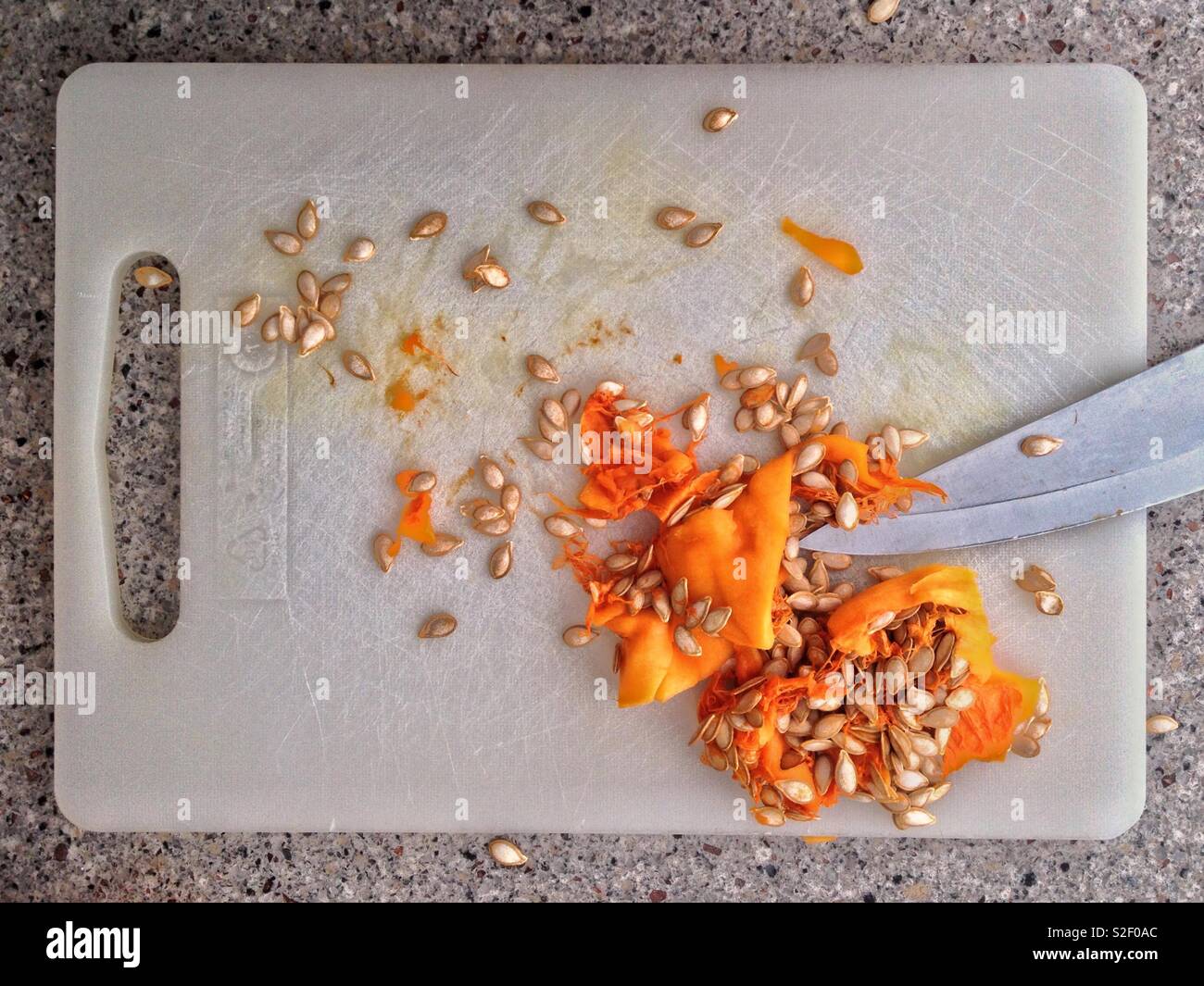 Pulp Kitchen Chopping board with pulp and seeds of butternut squash
