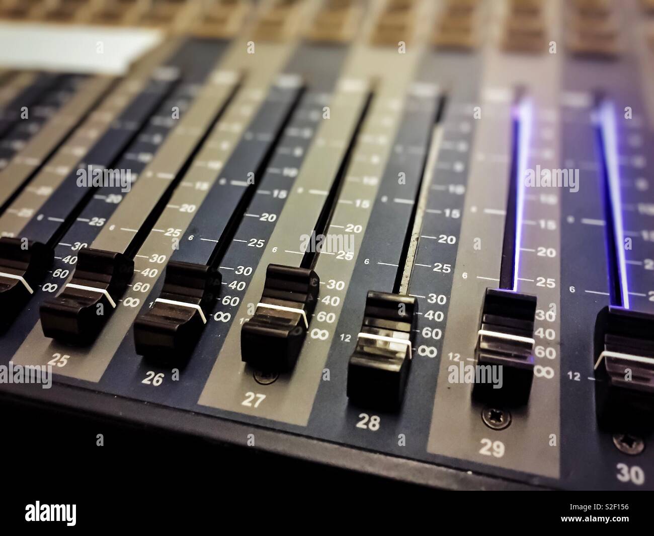 Professional audio mixer with black knobs to equalize sounds - Smartphone Captured Stock Image