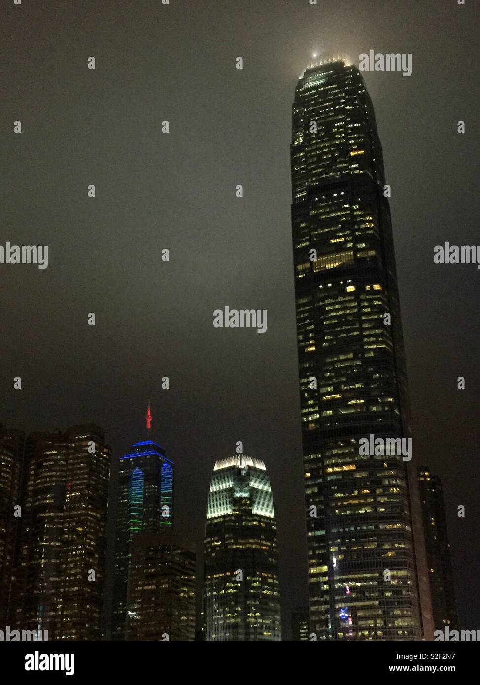 Hong Kong Island commercial skyscapers at night: (l to r) Exchange Square, The Center, 1ifc, and 2ifc, Hong Kong's second tallest - Smartphone Captured Stock Image