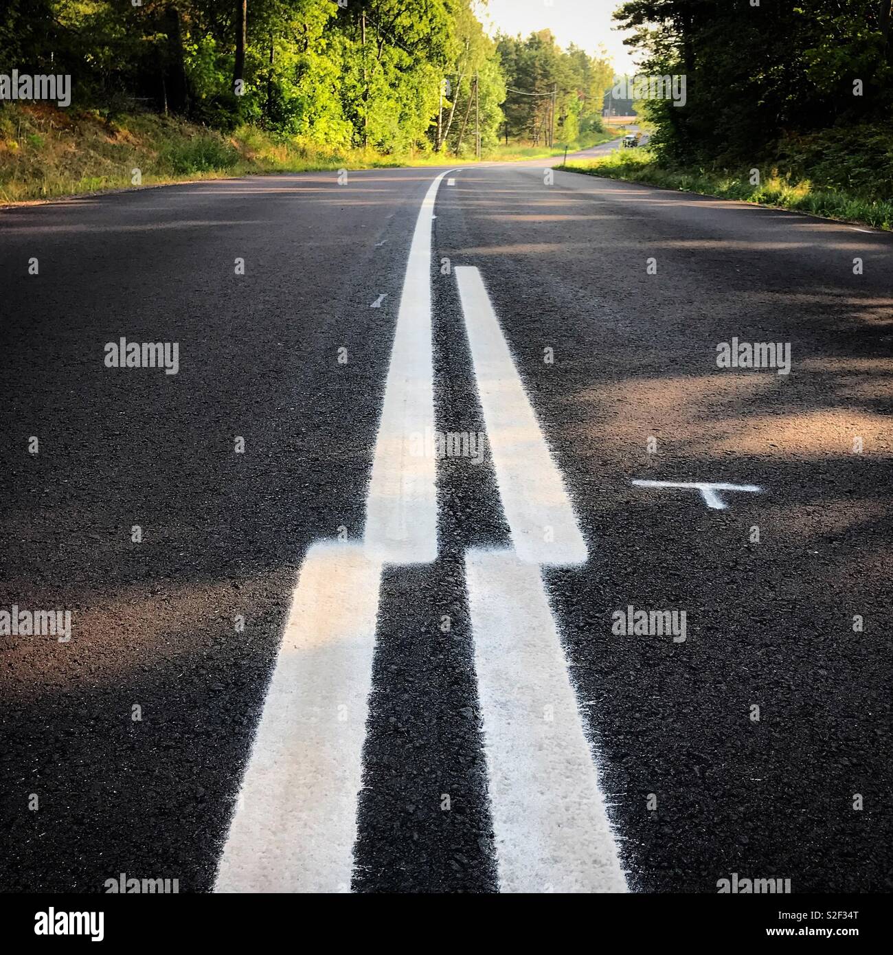 You only had one job! Newly painted highway road markings are nowhere near meeting up - Smartphone Captured Stock Image