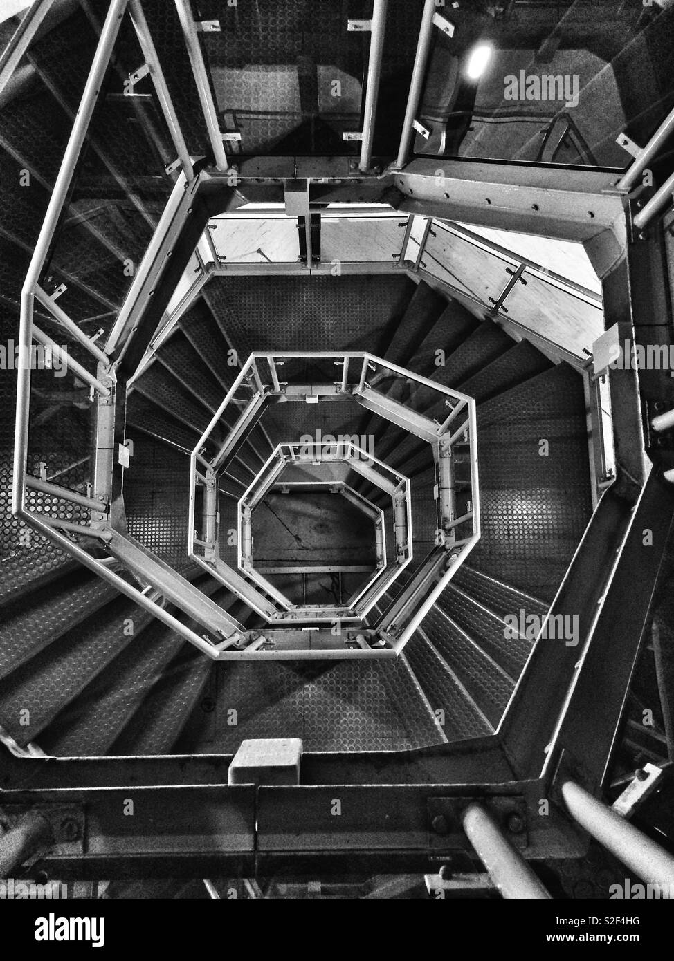 View of spiral stairs from the top of a chapel tower - Smartphone Captured Stock Image