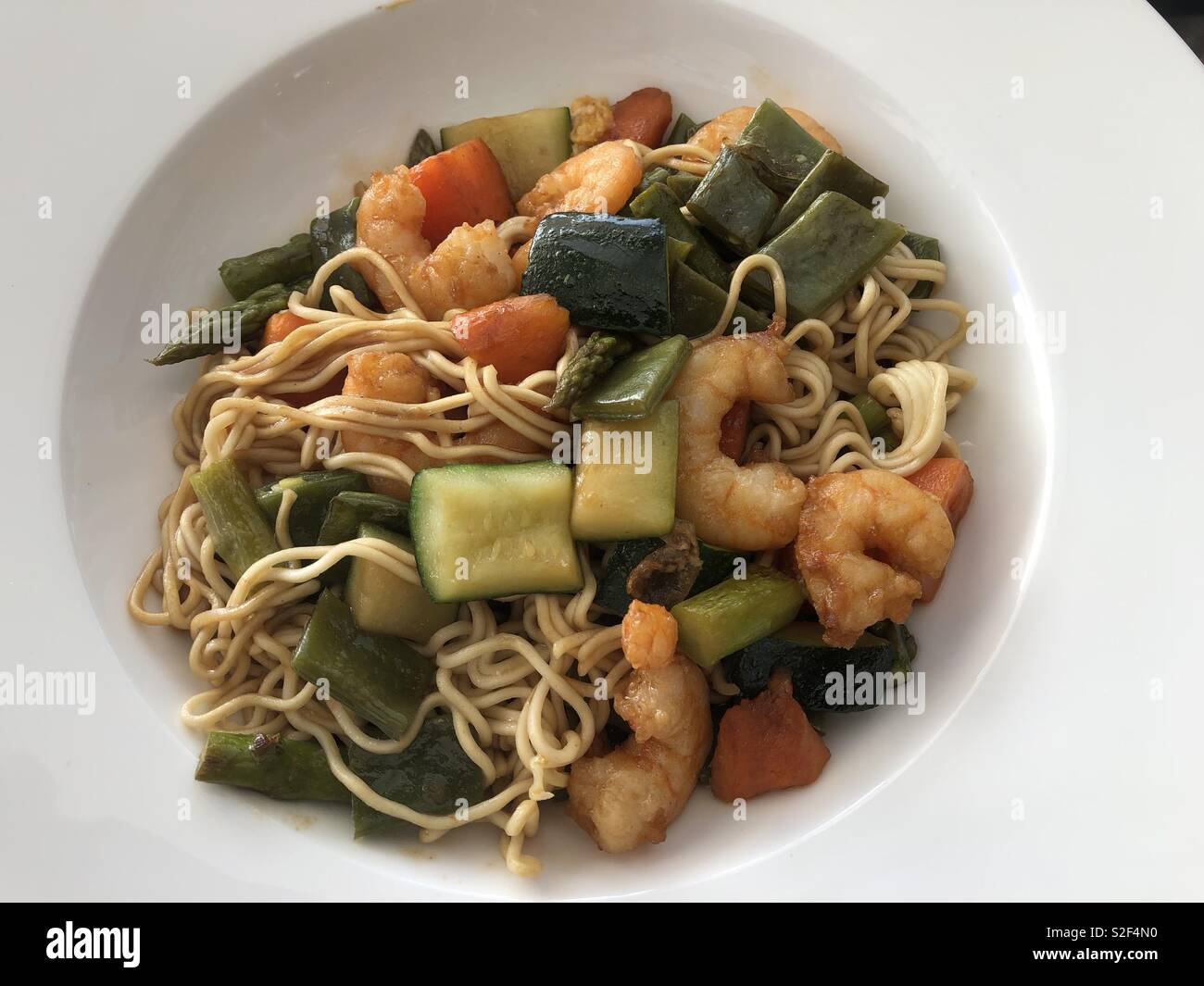 Meal of noodles vegetables and prawns - Smartphone Captured Stock Image