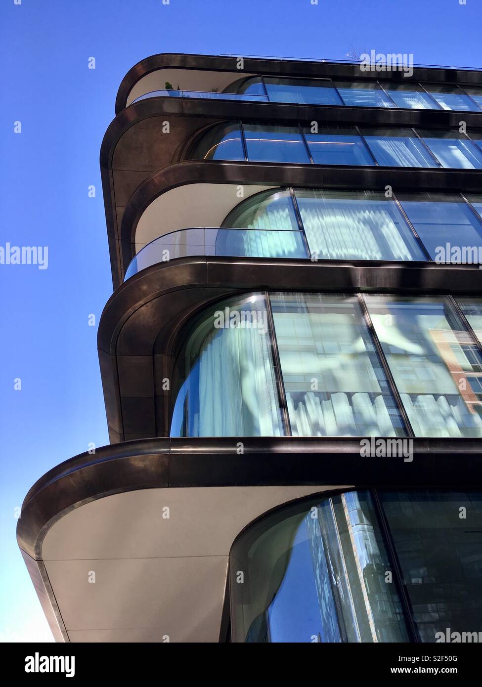 Sleek apartment block by Zaha Hamid, architect, 520 West 28th, Manhattan, New York - Smartphone Captured Stock Image