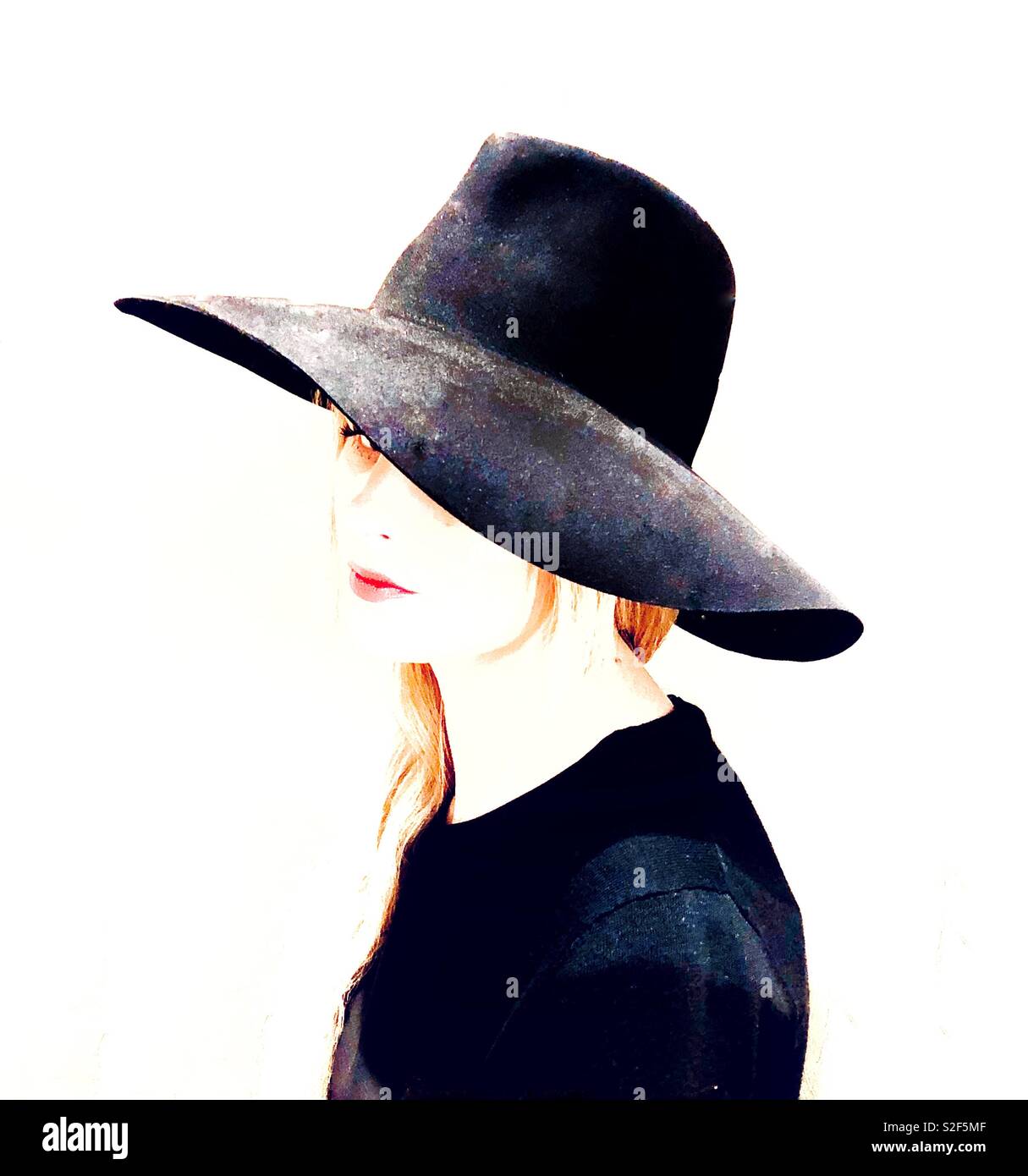 A fashionable young woman in a hat. - Smartphone Captured Stock Image