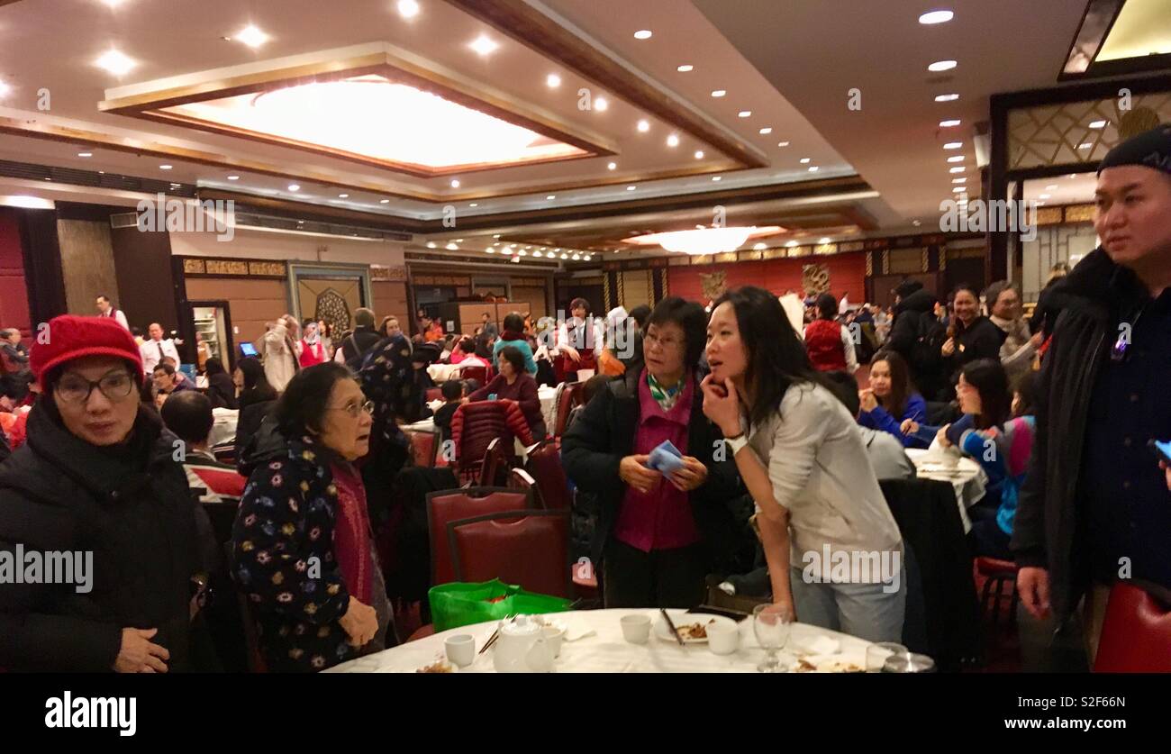 Female Chinese diners in a busy Chinese Restaurant - Smartphone Captured Stock Image