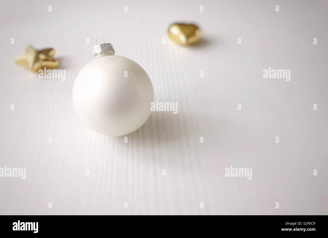 White Christmas ball with golden Christmas tree decorations - Smartphone Captured Stock Image
