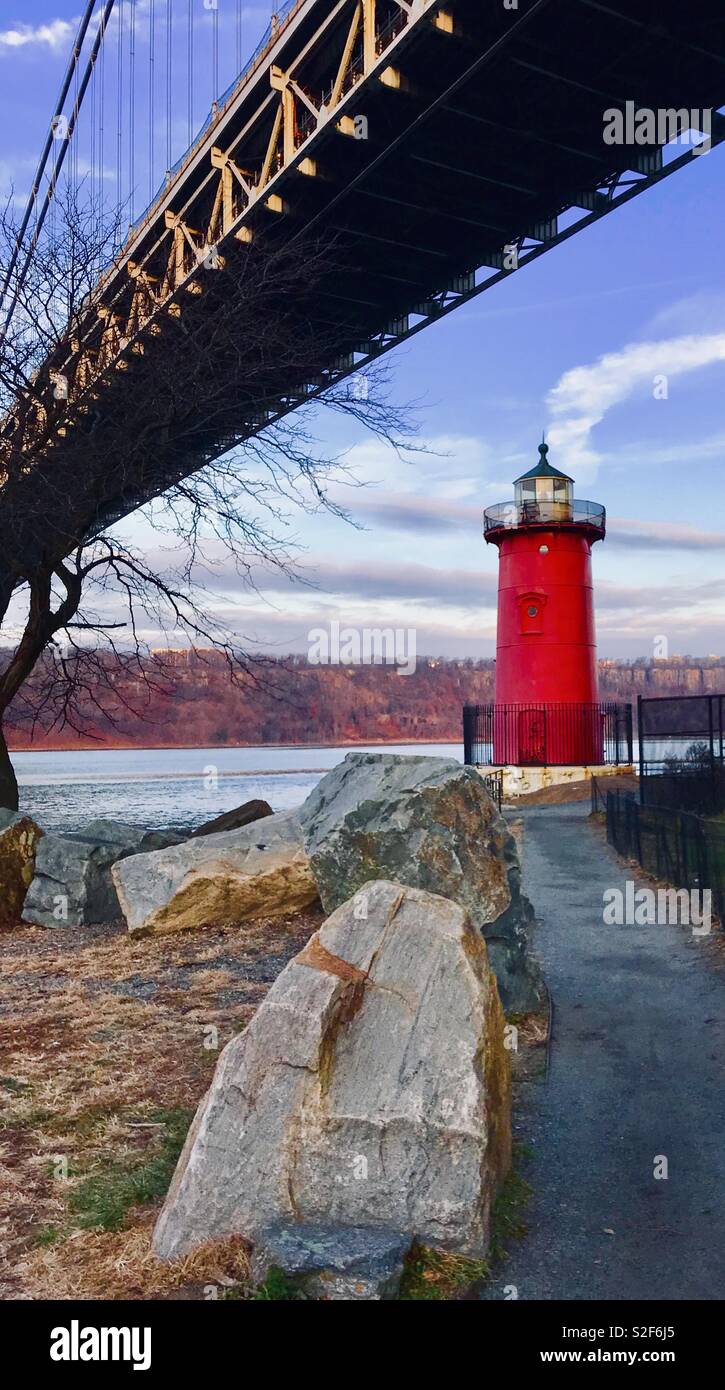 Little red lighthouse and George Washington Bridge Stock Photo