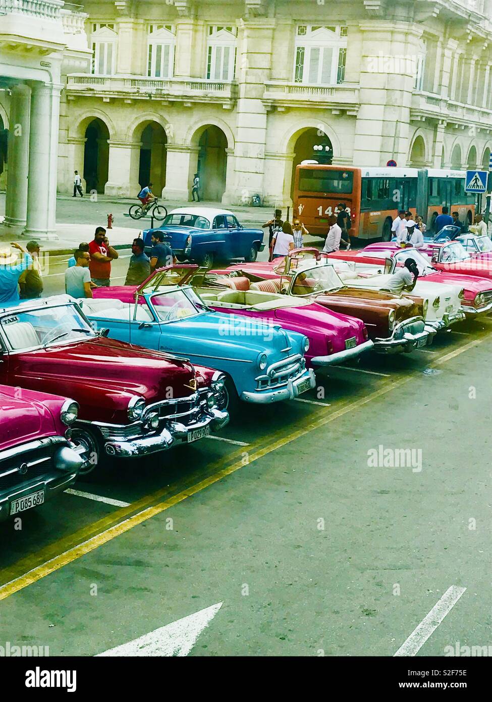 Colourful classic cars all parked in the centre of Havana Cuba Stock Photo