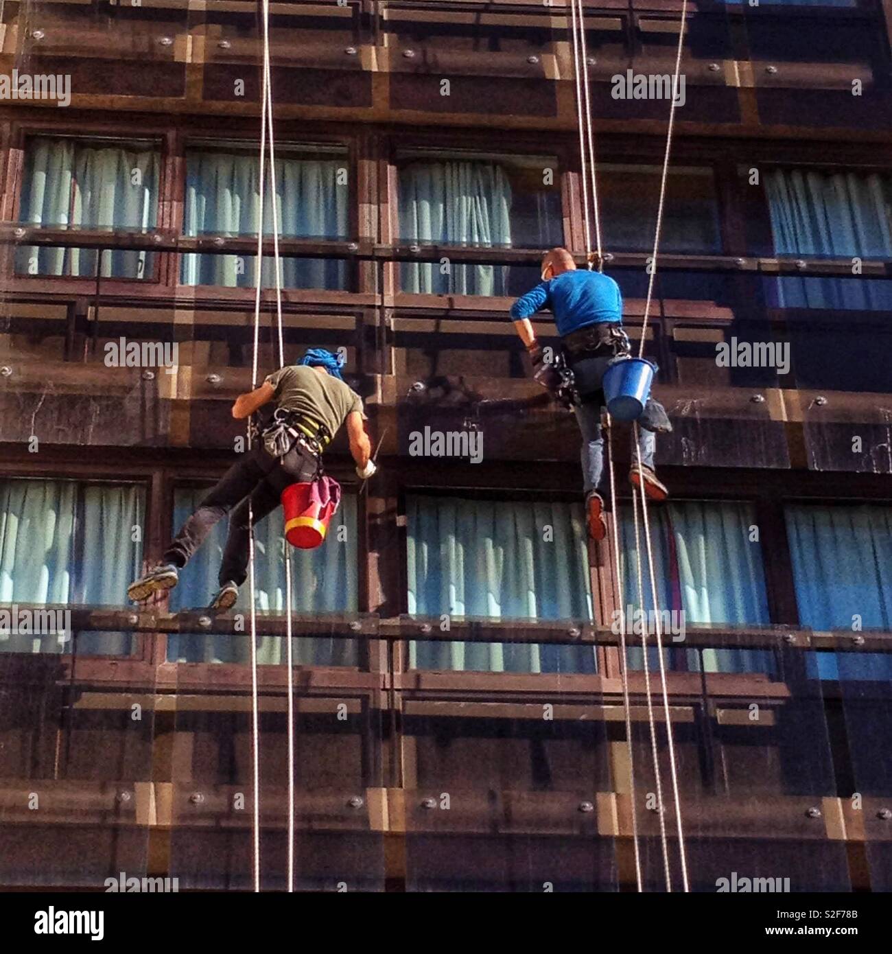 Window washers, acrobatic work Stock Photo