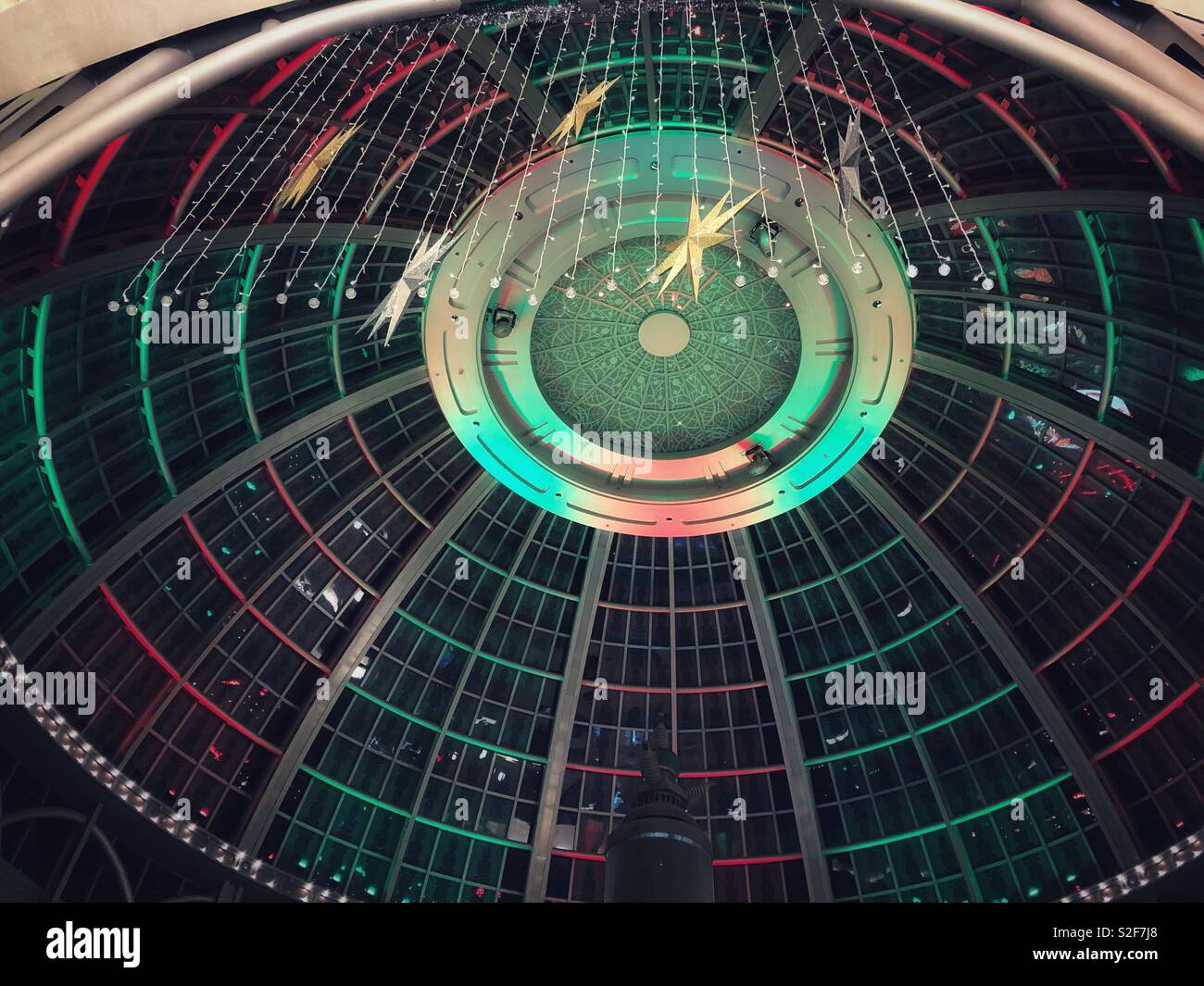 Looking up at the festive-coloured dome glass ceiling at Fallsview Casino in Niagara Falls, Canada. - Smartphone Captured Stock Image