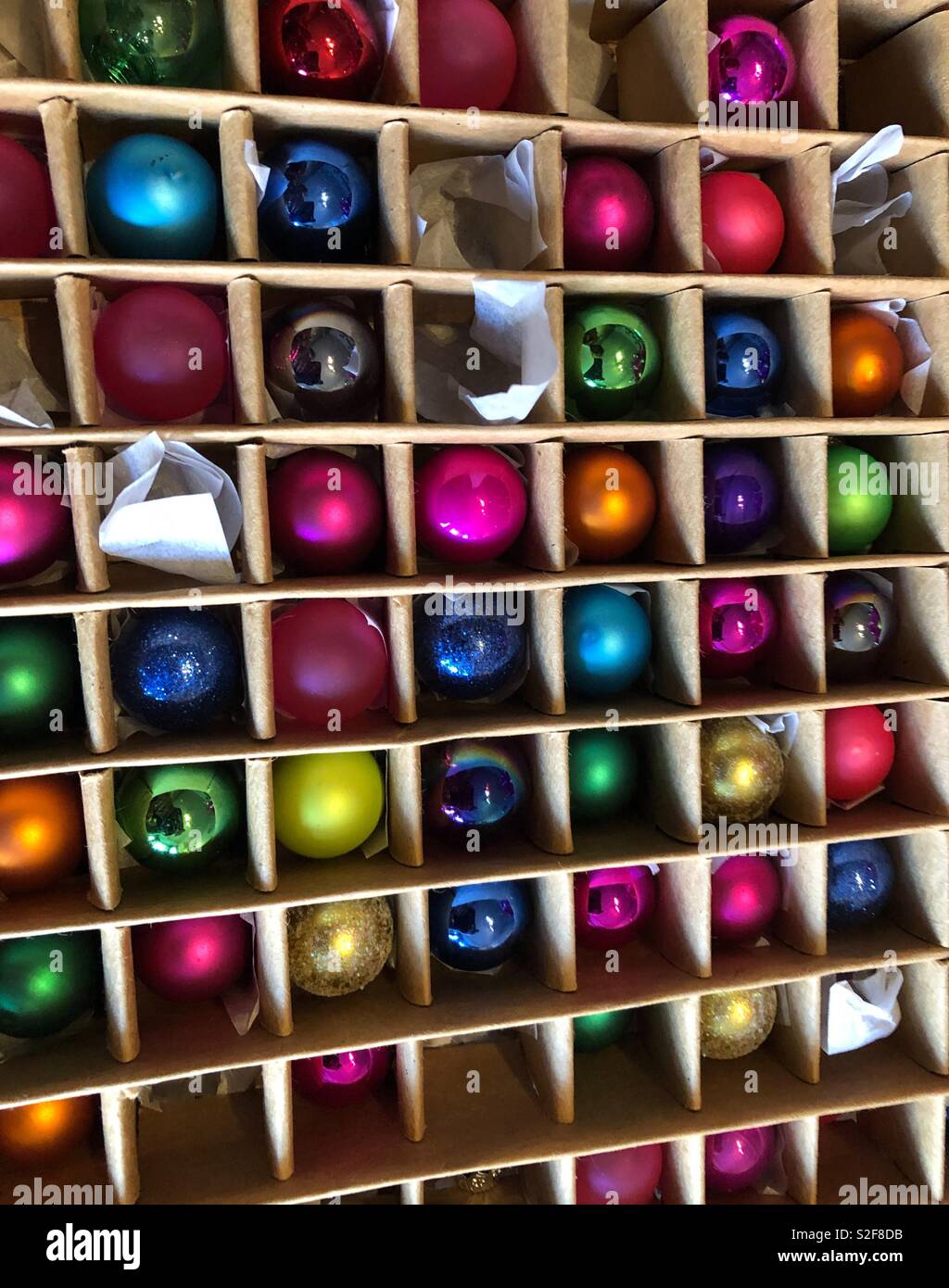 Multi coloured Christmas baubles in brown box Stock Photo Alamy