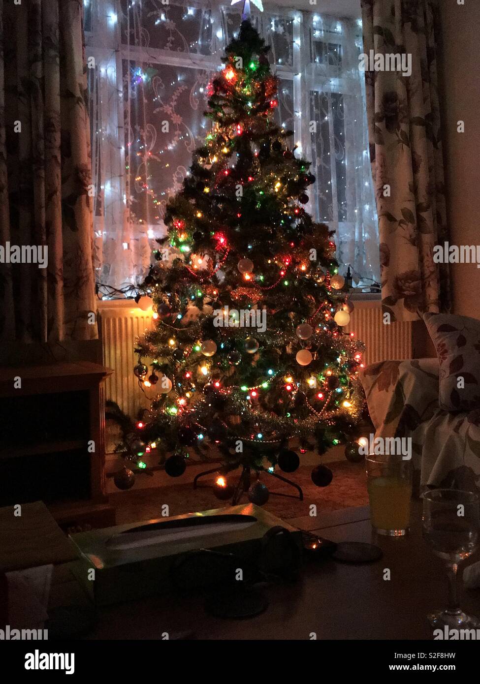 Christmas tree in a living room window - Smartphone Captured Stock Image