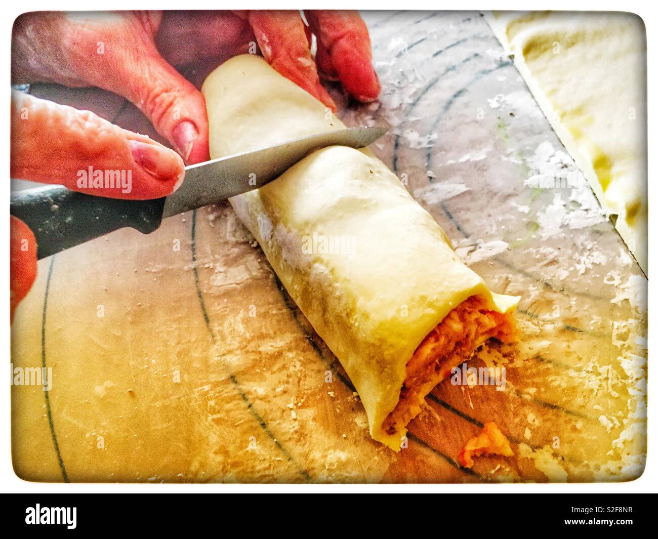 Making sausage rolls - Smartphone Captured Stock Image