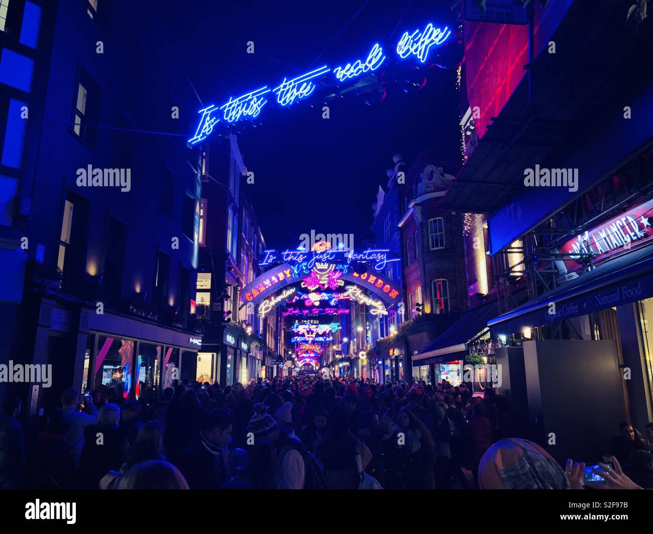 Packed carnaby street with Christmas lights December 2018 Stock Photo