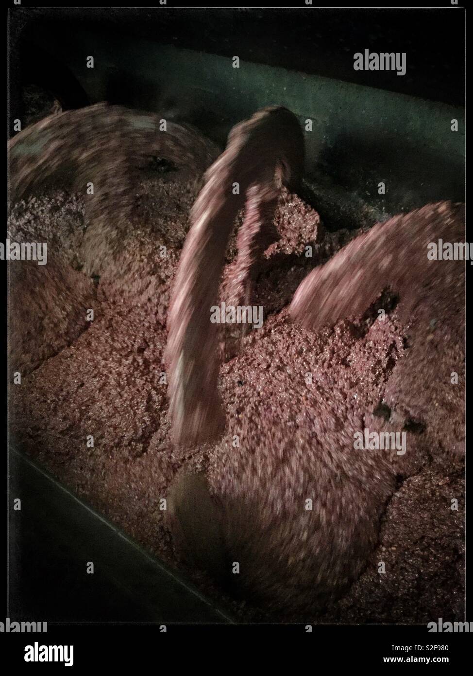 The malaxer in the Pieralisi mill used for processing olives into olive oil, Catalonia, Spain. - Smartphone Captured Stock Image