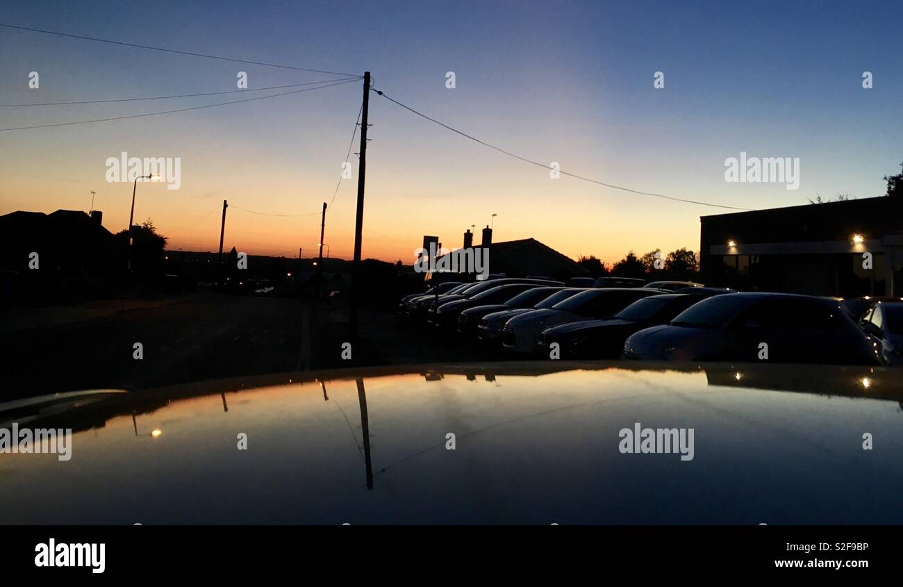 Sunset over vehicles - Smartphone Captured Stock Image