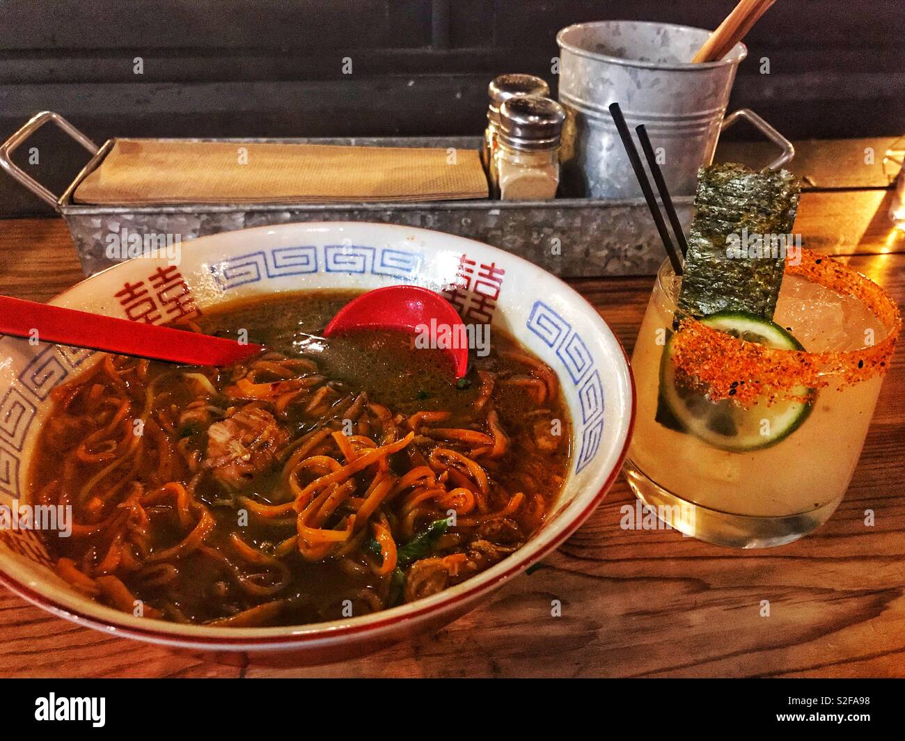 Ramen Noodle Soup and Spicy Margarita with Seaweed and Lime Stock Photo