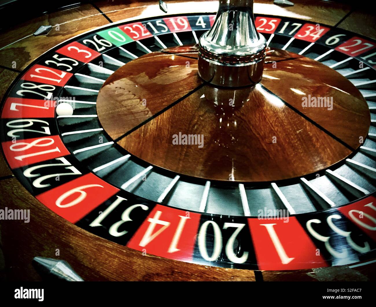 A ball lands in red 7 on a roulette wheel. - Smartphone Captured Stock Image