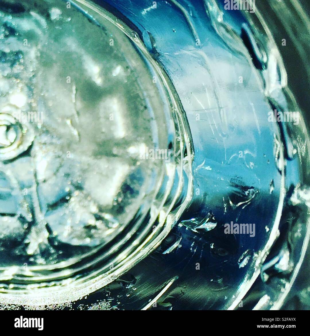 frozen water bottle for hiking partially thawed. bottle shape keeps ice  from floating Stock Photo - Alamy