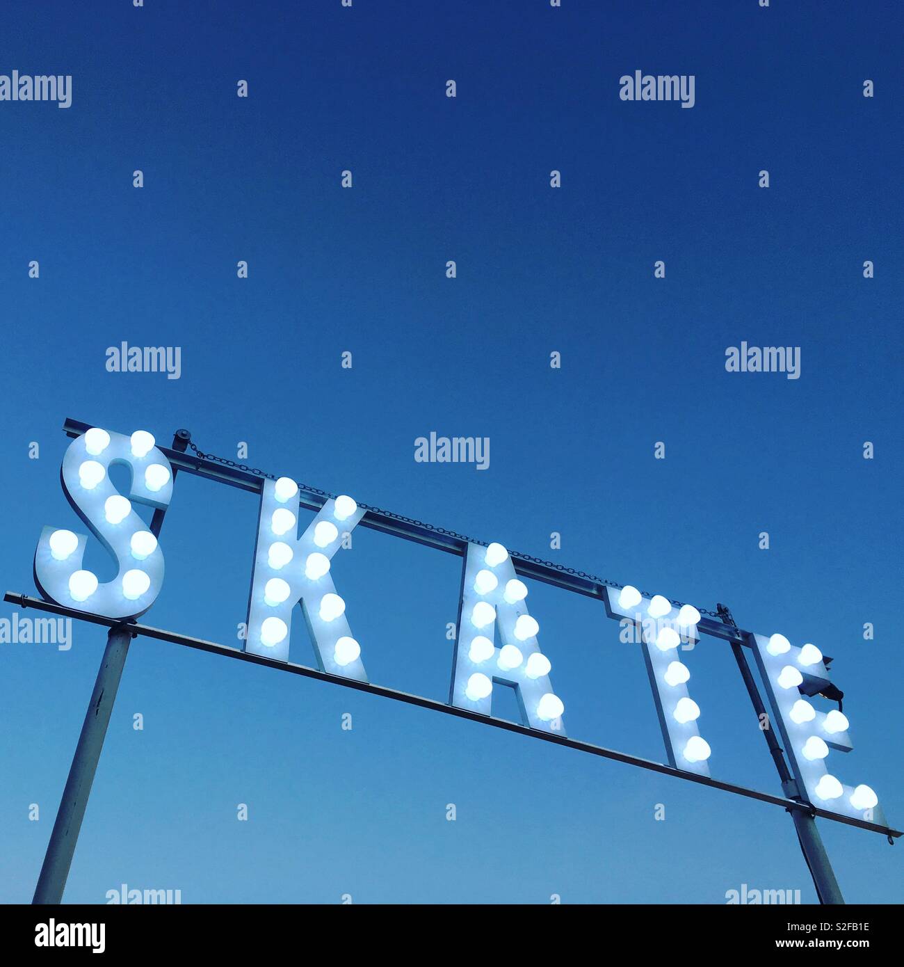 Skate sign above an ice rink - Smartphone Captured Stock Image