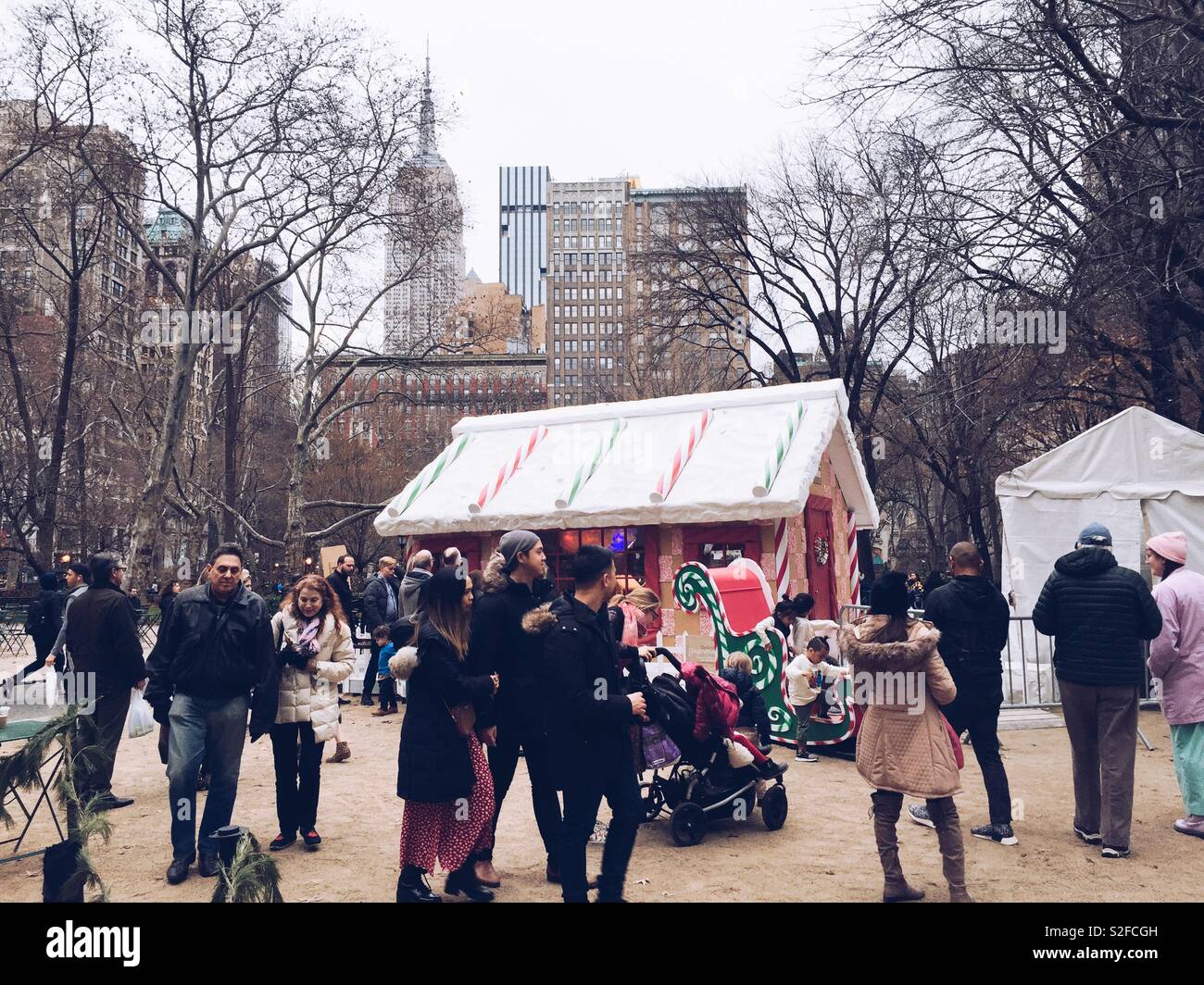 Life-size gingerbread house display at Madison Square Park, New York City, USA - Smartphone Captured Stock Image