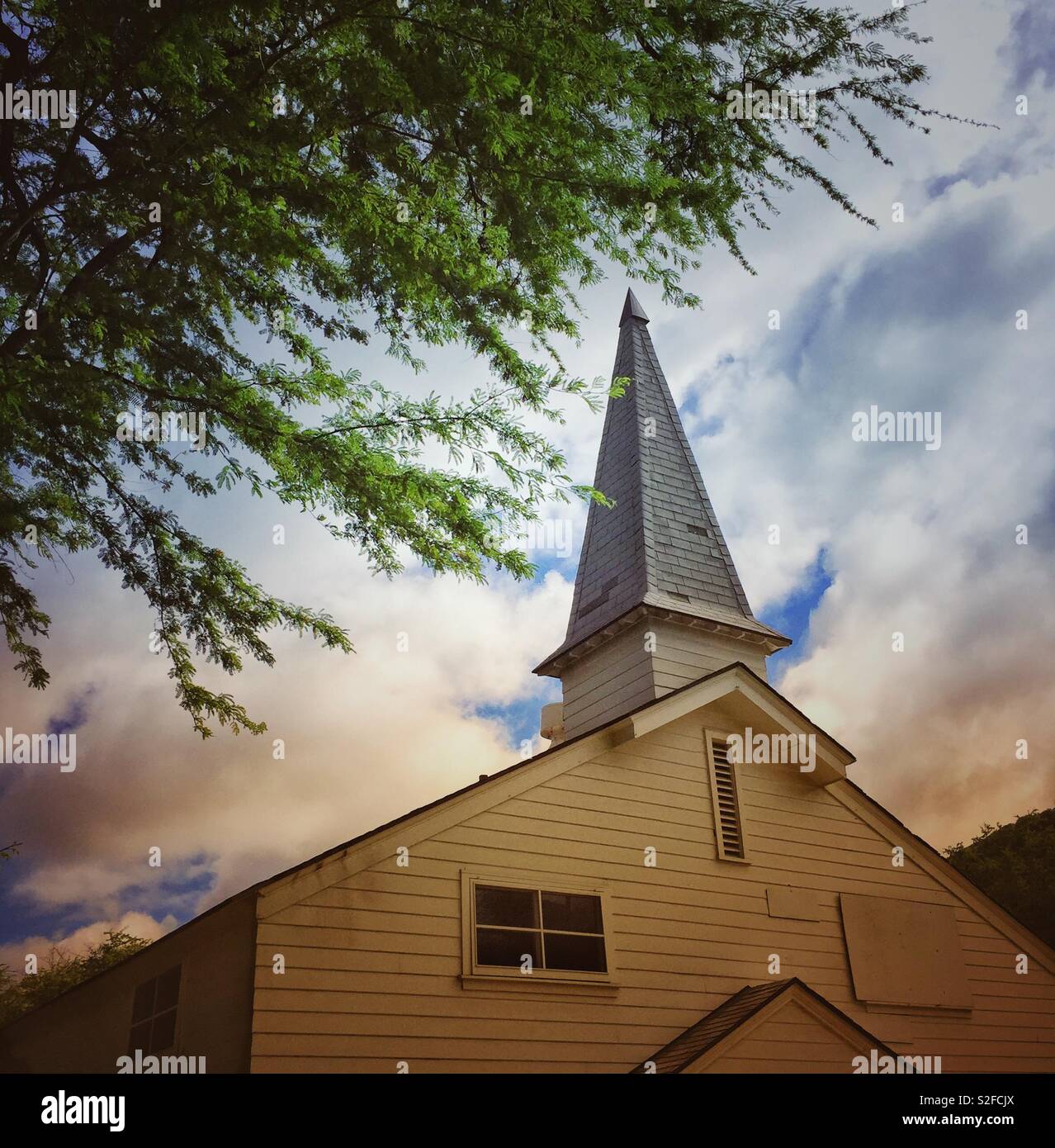 Country church steeple in early morning light Stock Photo