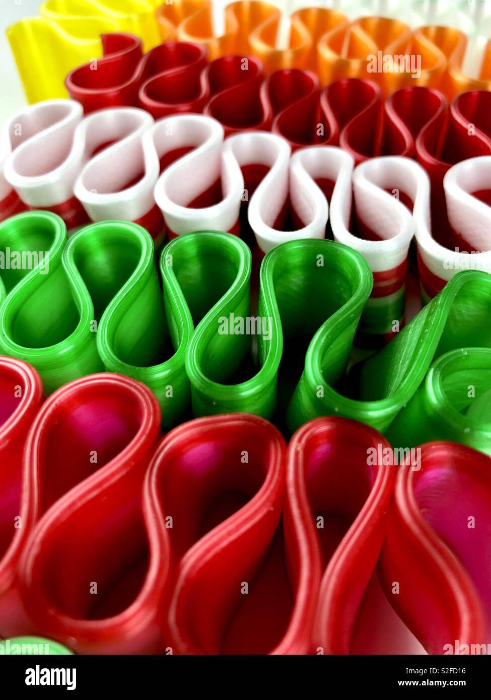 Brightly colored ribbon candy on a white background - Smartphone Captured Stock Image