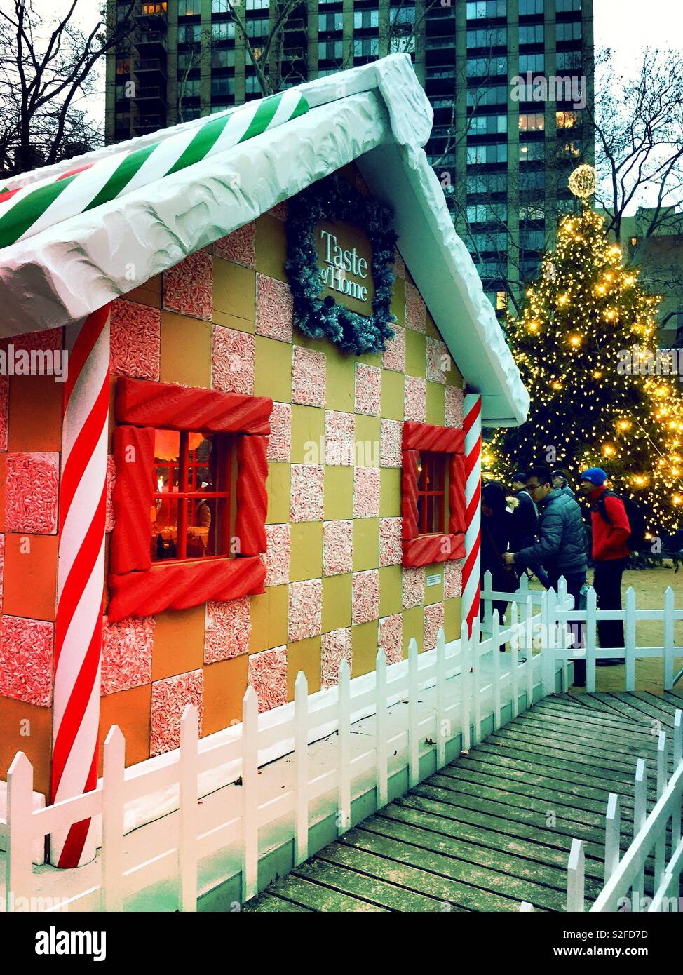 Life-size corporate sponsored gingerbread house, Madison Square, Park during the Christmas season NYC, USA - Smartphone Captured Stock Image