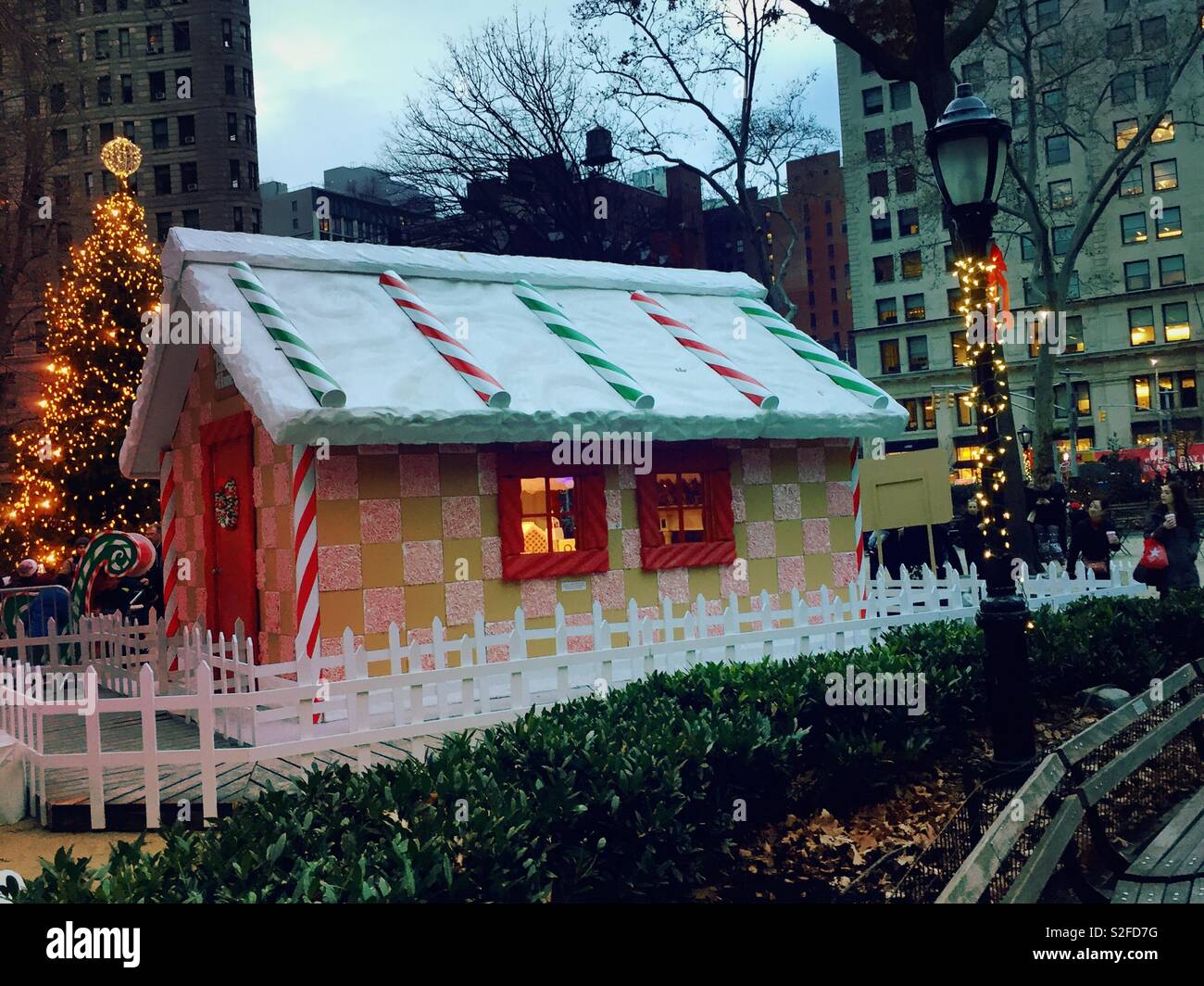 Life-size corporate sponsor gingerbread house in Madison Square, Park during the Christmas season, NYC, USA - Smartphone Captured Stock Image