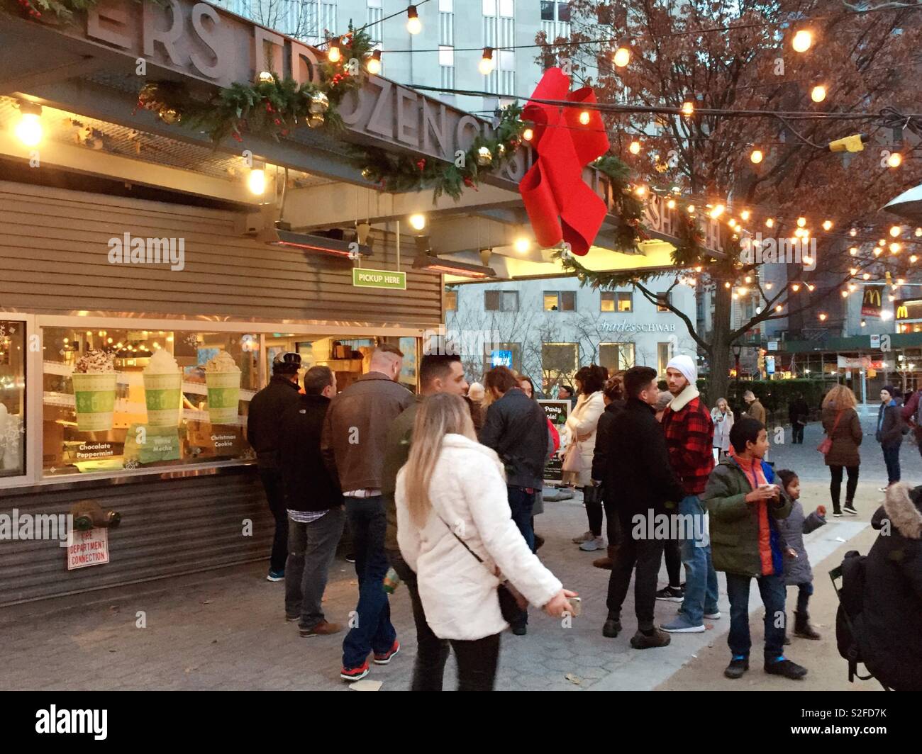 Customers at the Shake shack decorated with holiday Decorations Madison Square, Park, New York City, United States - Smartphone Captured Stock Image