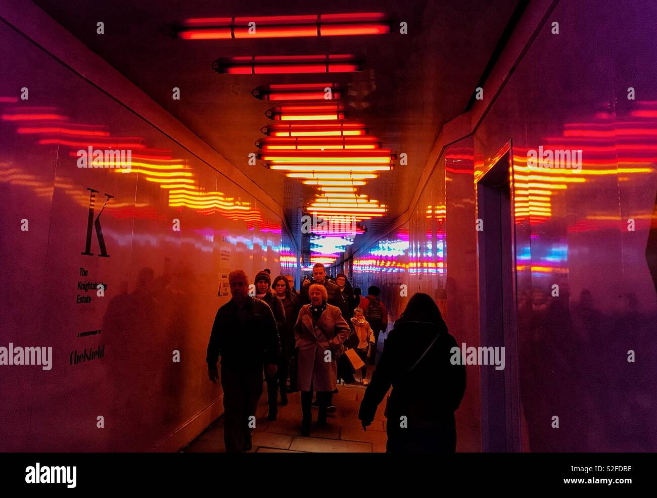 Colored neon lighting in a covered sidewalk - Smartphone Captured Stock Image