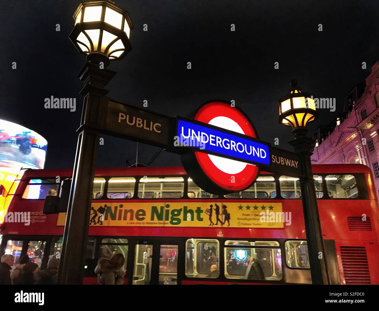 London Underground sign in Piccadilly Circus at night Stock Photo
