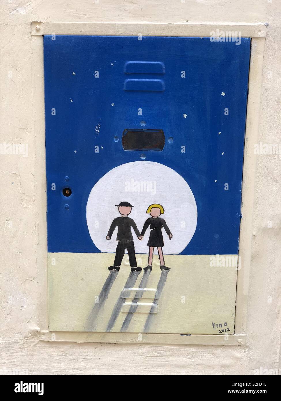 You and me, us design, creative graffiti over a metallic counter of the gas meter - Smartphone Captured Stock Image