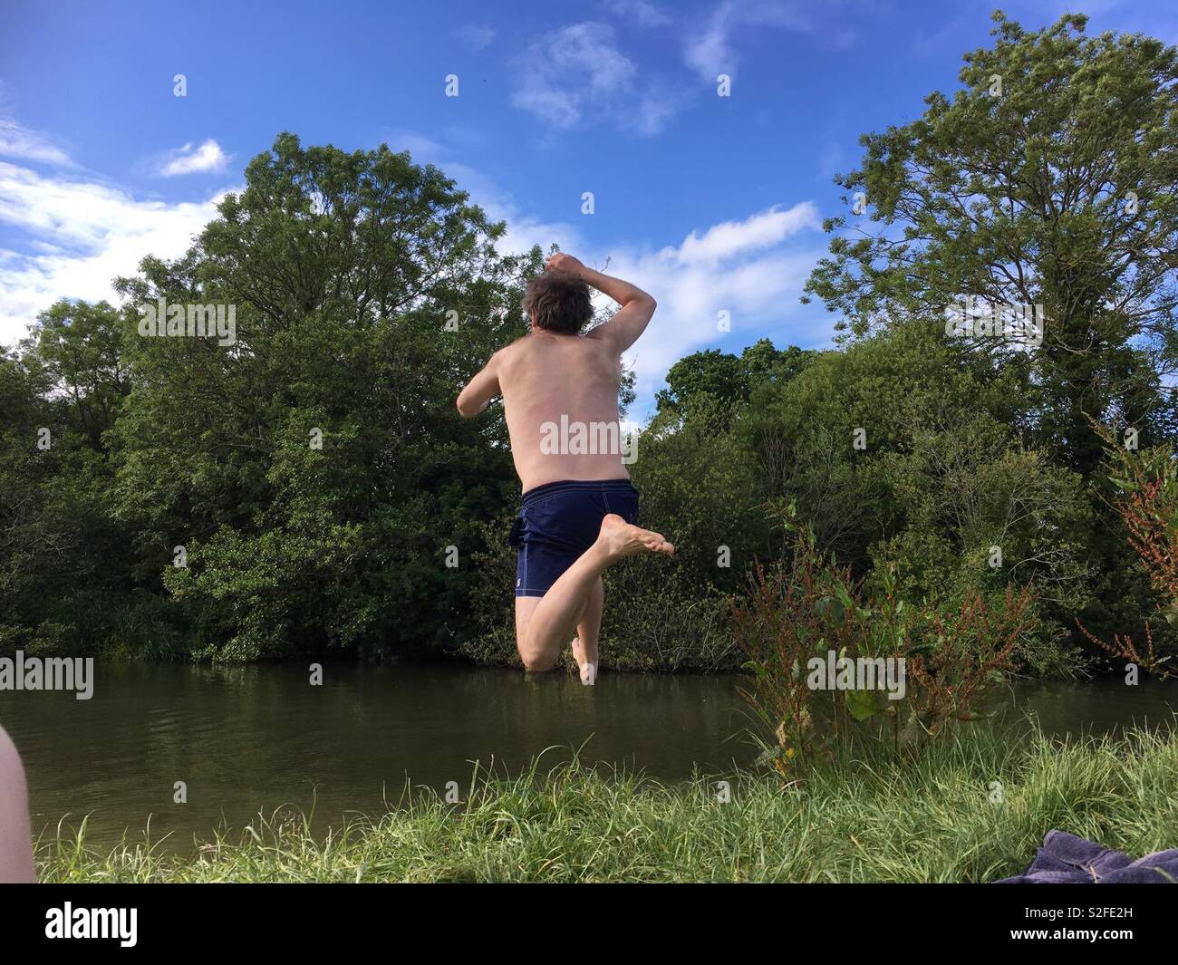 Jumping in River Stock Photo Alamy