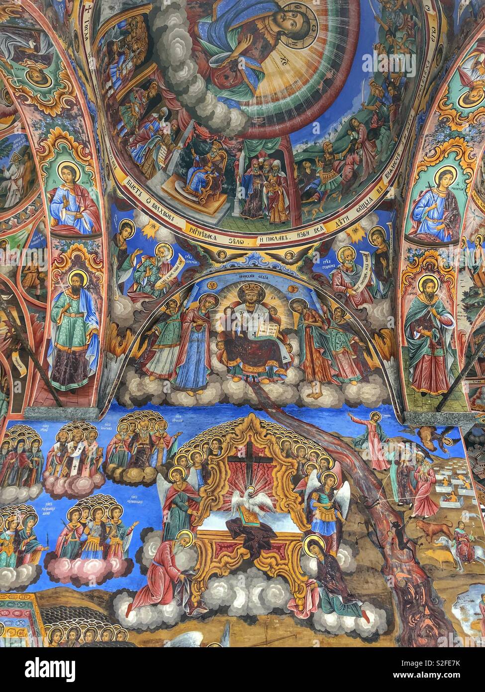 Colourful painted iconic frescoes on the walls and ceilings of the Rila Monastery, a UNESCO World Heritage Site in Bulgaria. - Smartphone Captured Stock Image