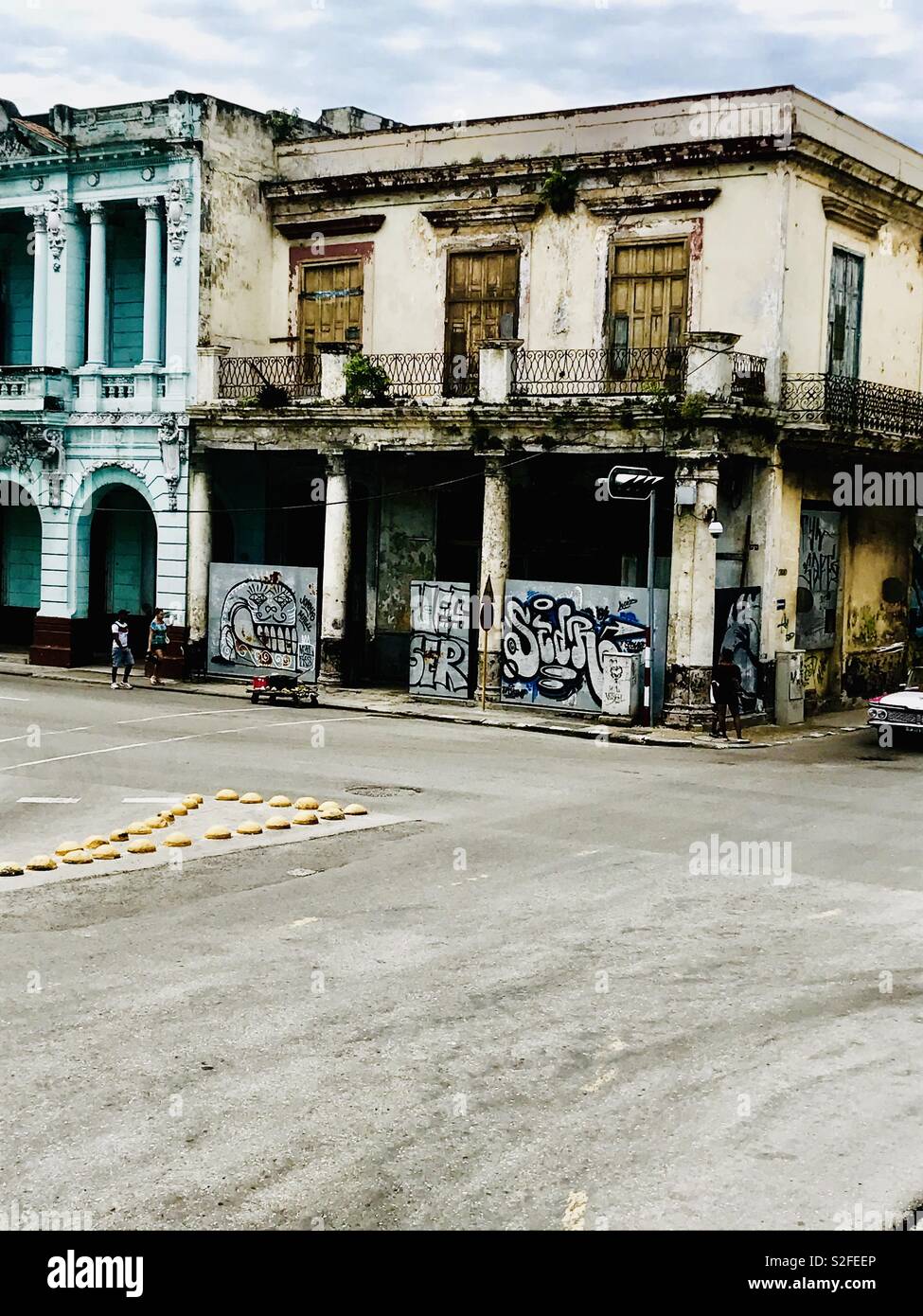 Derelict colonial building covered in Graffiti in Havana Cuba Stock Photo