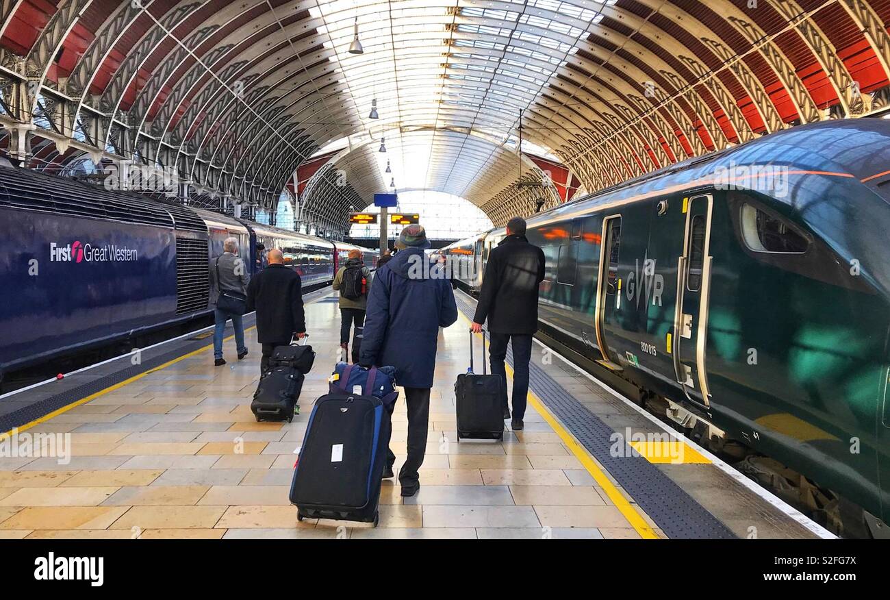 Passengers walking along a platform at London Paddington Station to board an inter city train - Smartphone Captured Stock Image