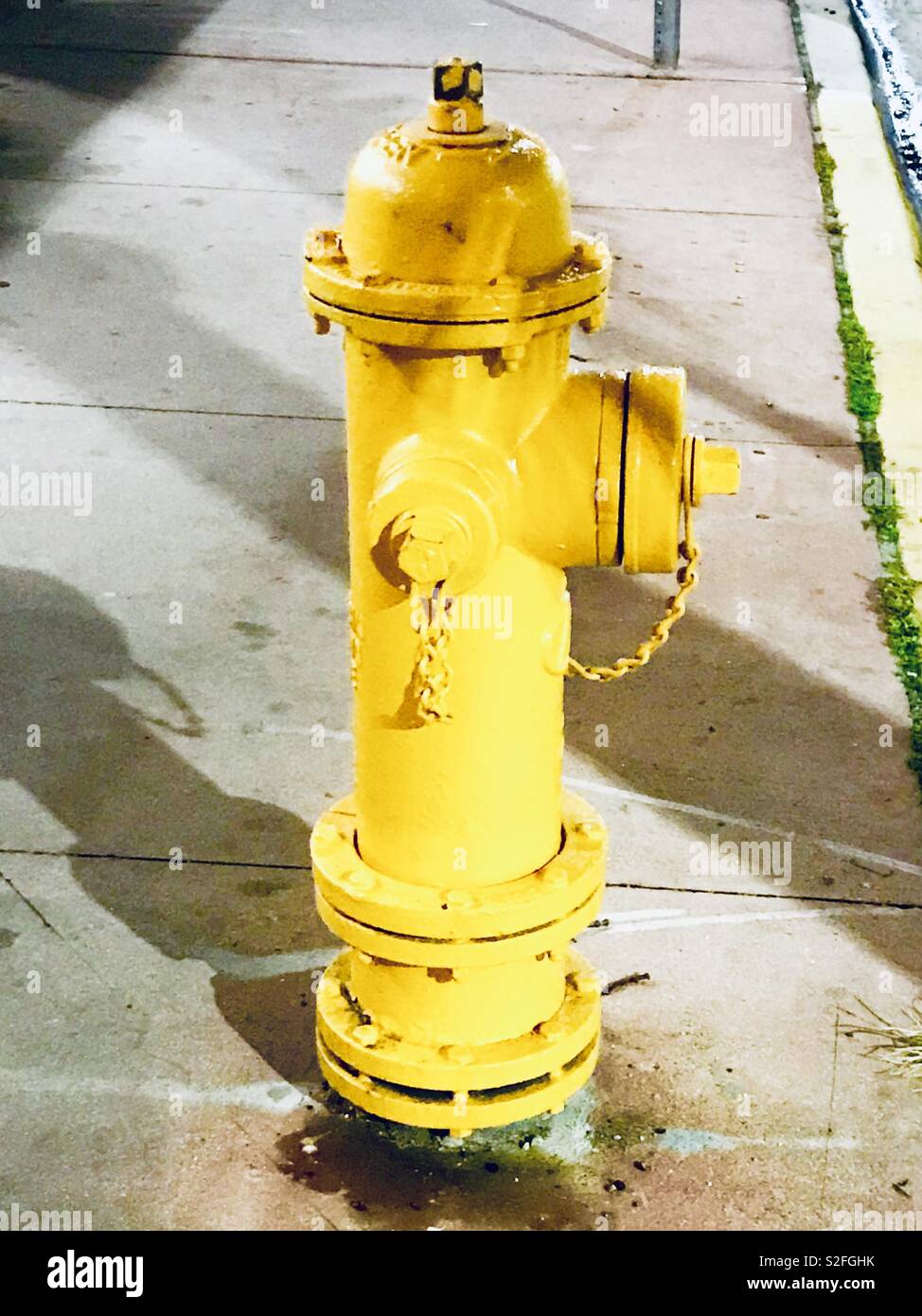 Bright yellow fire hydrant Stock Photo