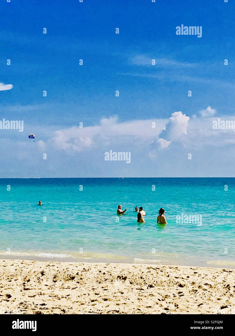 People having fun in the sea at South Beach Miami Florida Stock Photo
