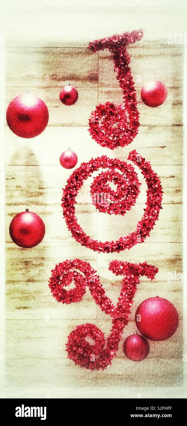 Joy Christmas decorations with tinsel and baubles. - Smartphone Captured Stock Image