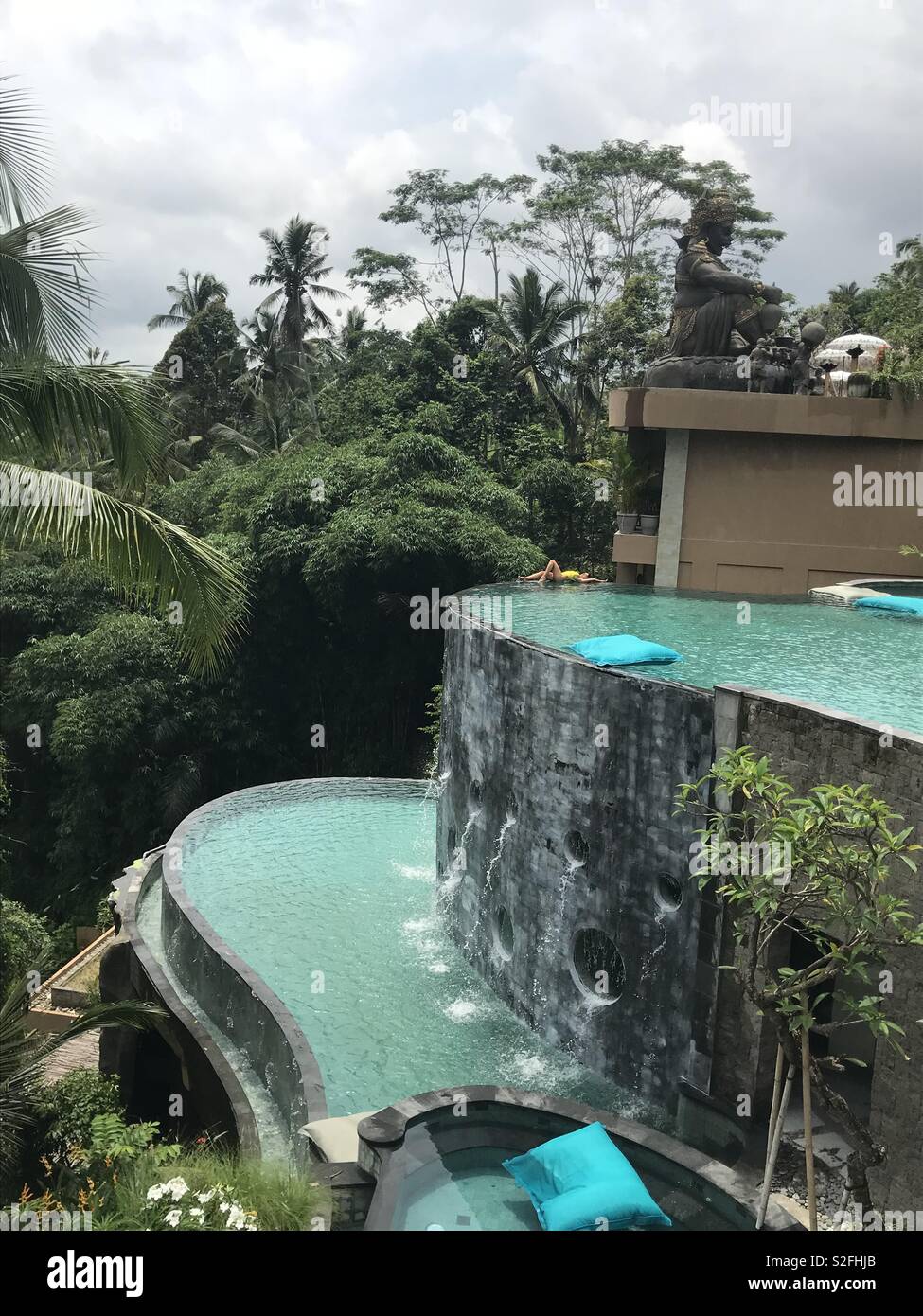 Girl baby Bali pool vocation relex trip sun bikini palm natural perfect perfection green hotel resort view chill Stock Photo