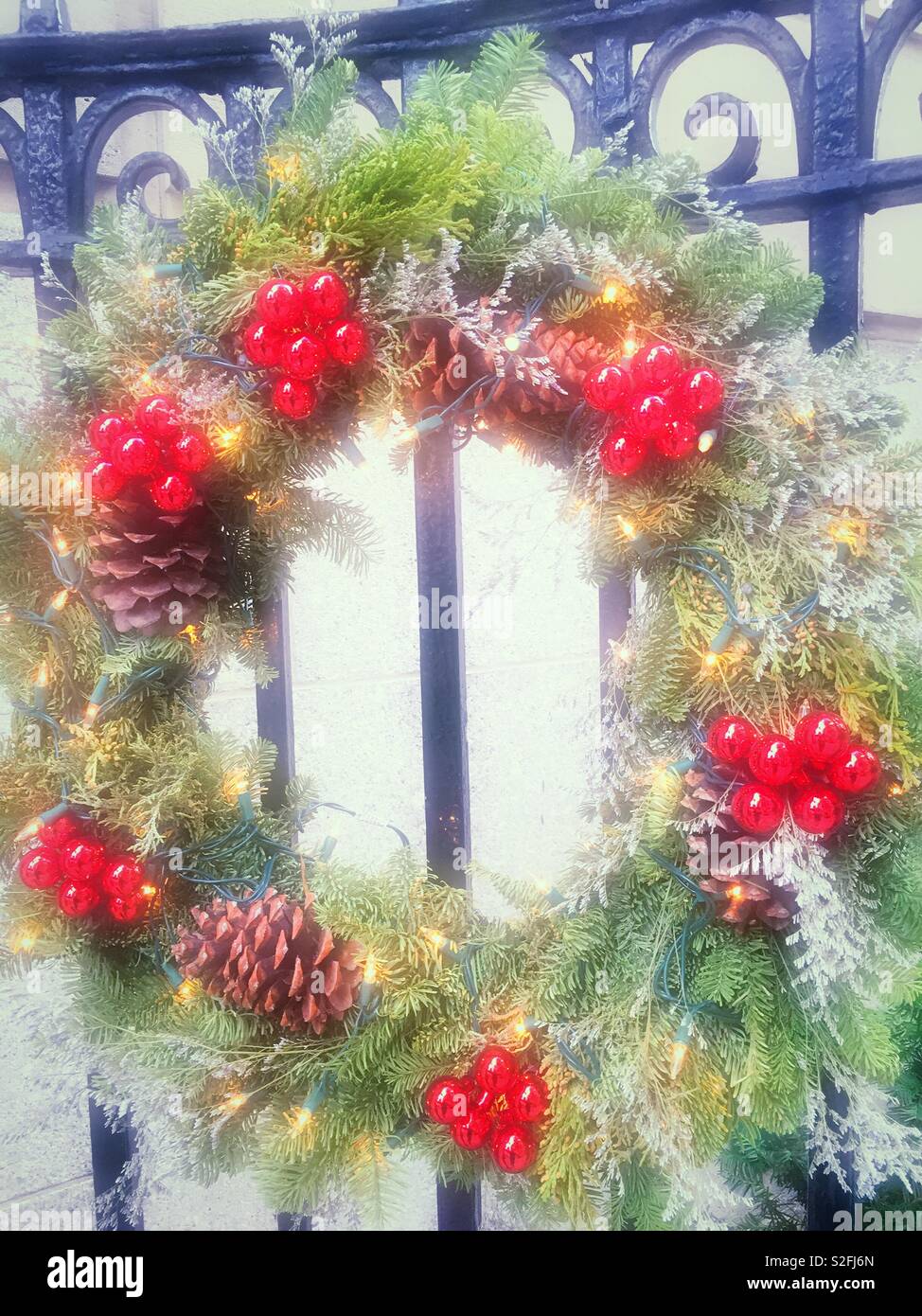 Holiday wreath with red berries and pinecones, United States Stock ...