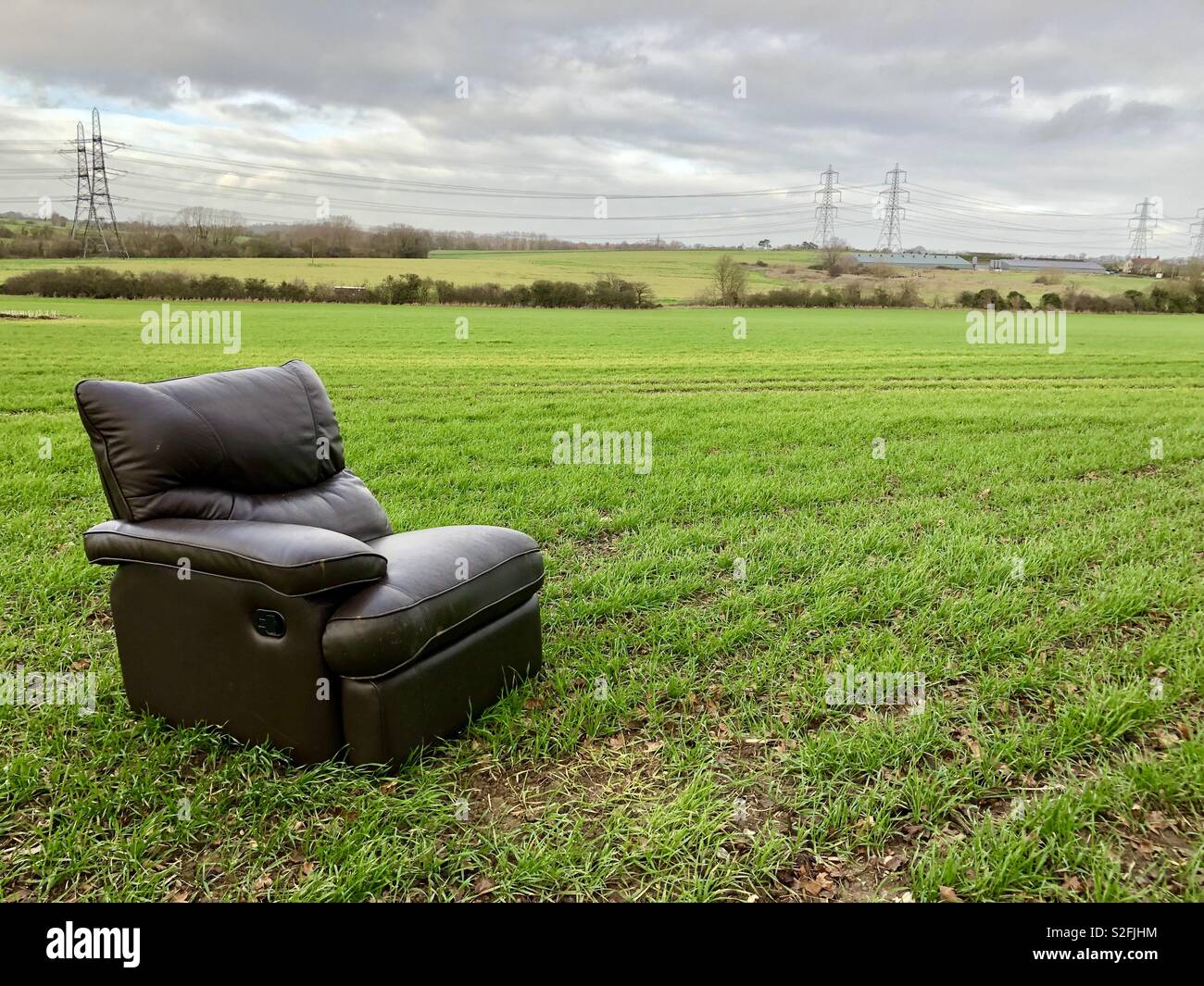 An armchair dumped in a field Stock Photo
