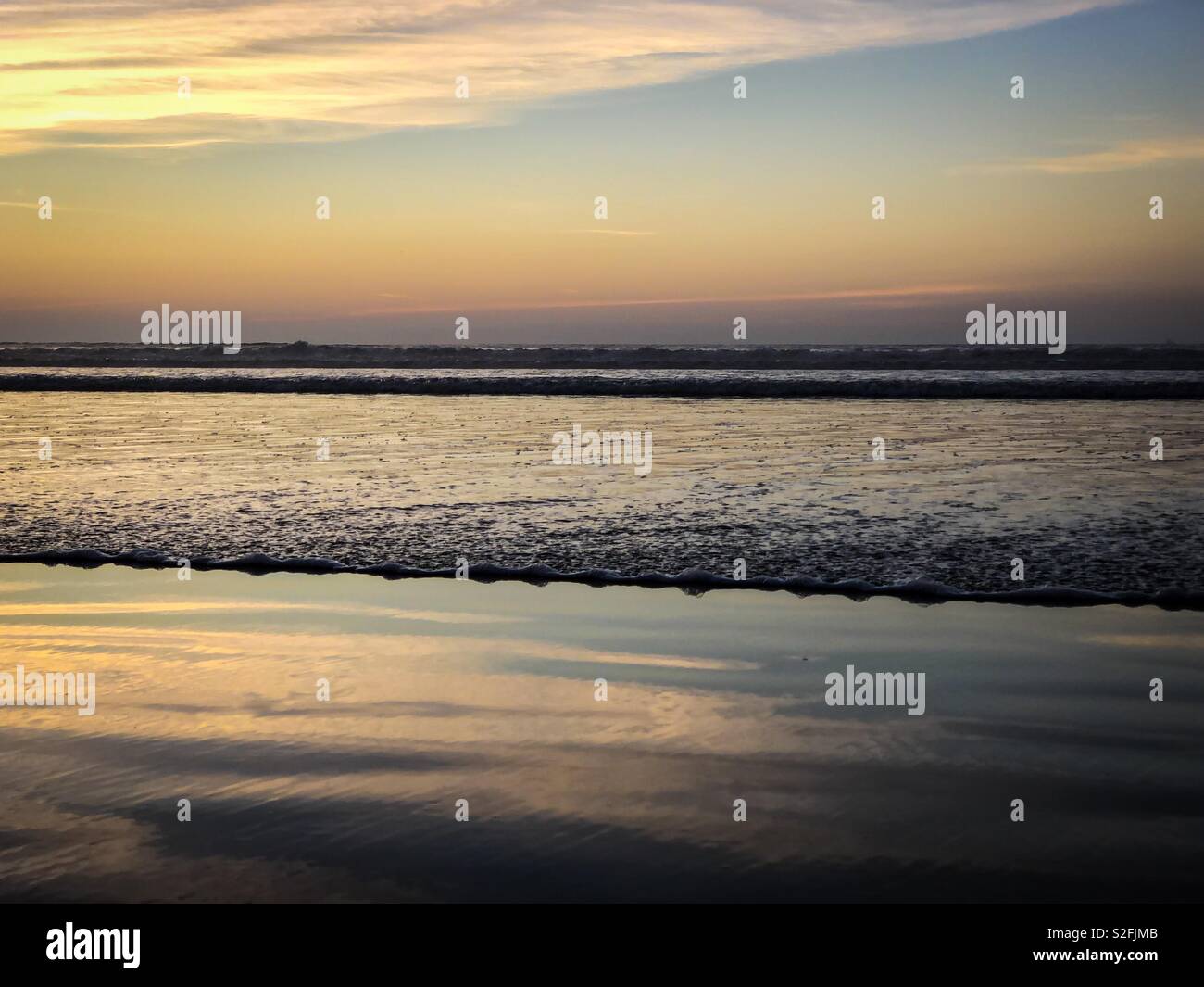 Sunset over the Atlantic Ocean from Agadir beach, Morocco, Africa - Smartphone Captured Stock Image