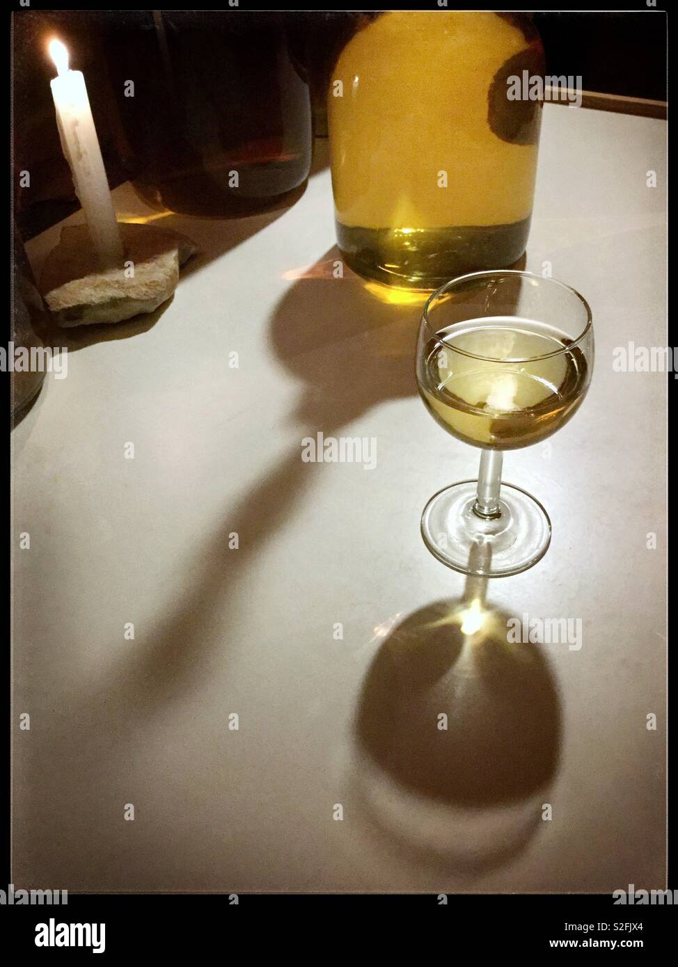 A candlelit glass of Viognier wine. - Smartphone Captured Stock Image