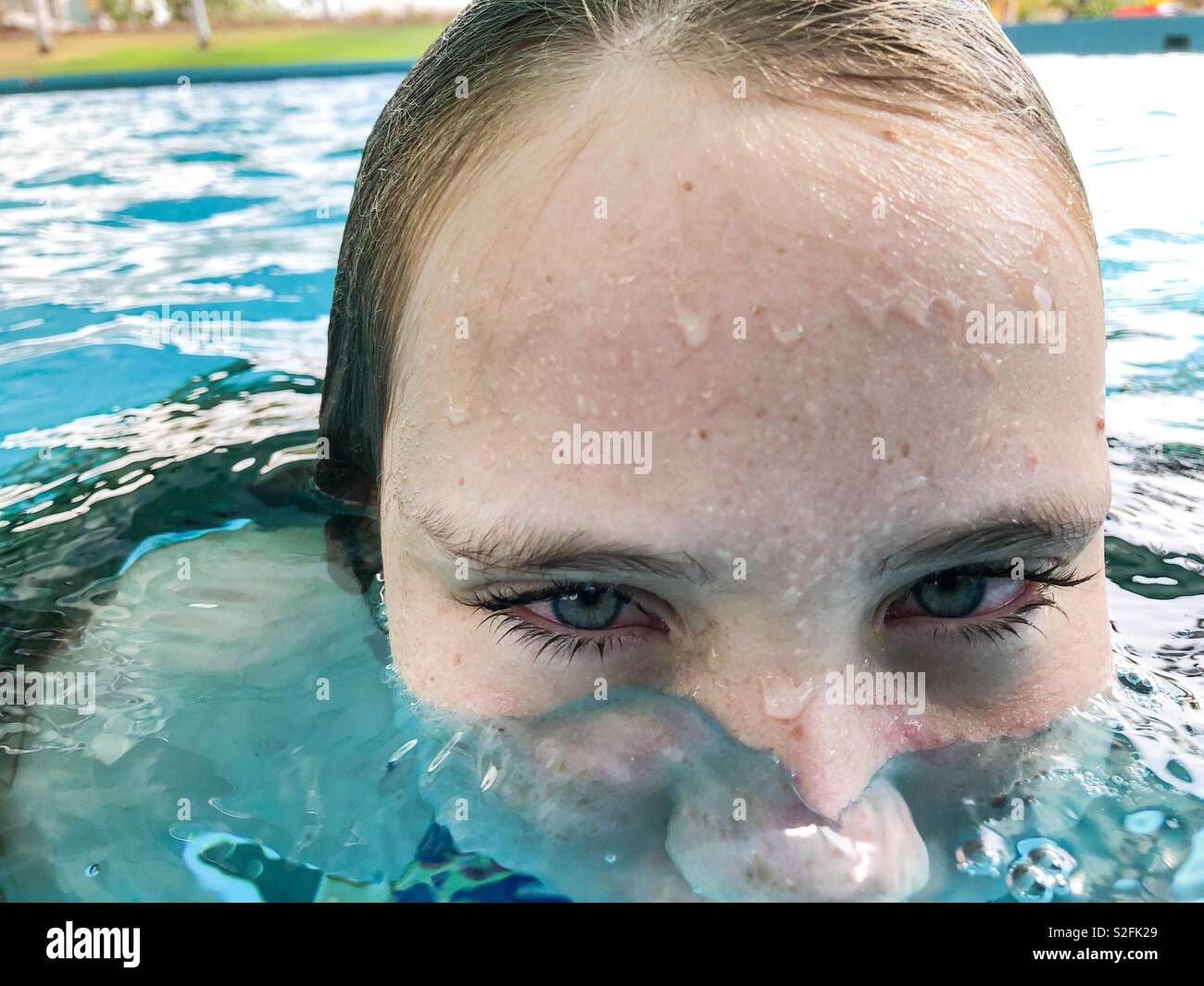 Close up portrait of a girl in a swimming pool. Stock Photo