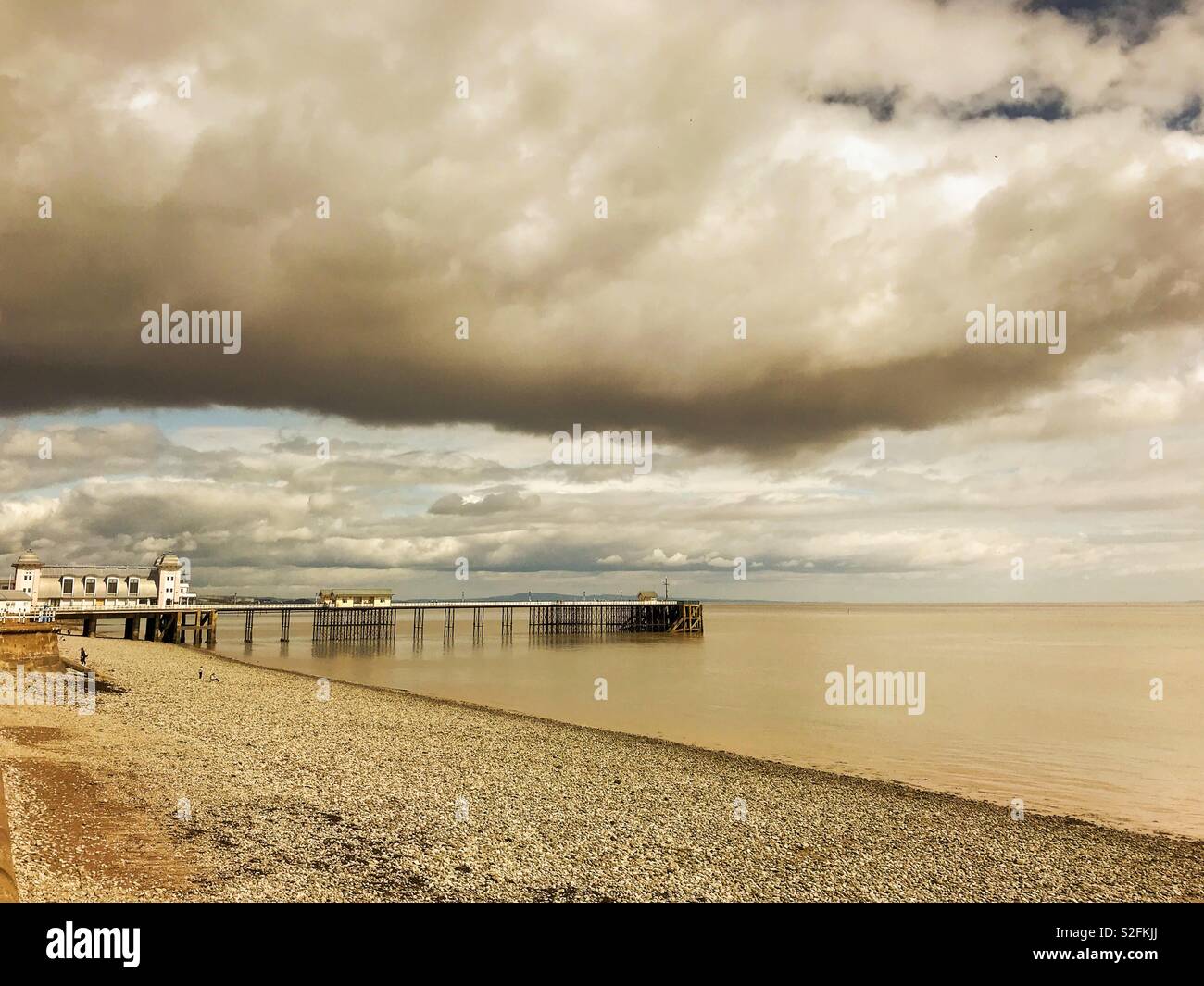 Penarth pier near Cardiff, Wales, at low tide on a cloudy day - Smartphone Captured Stock Image