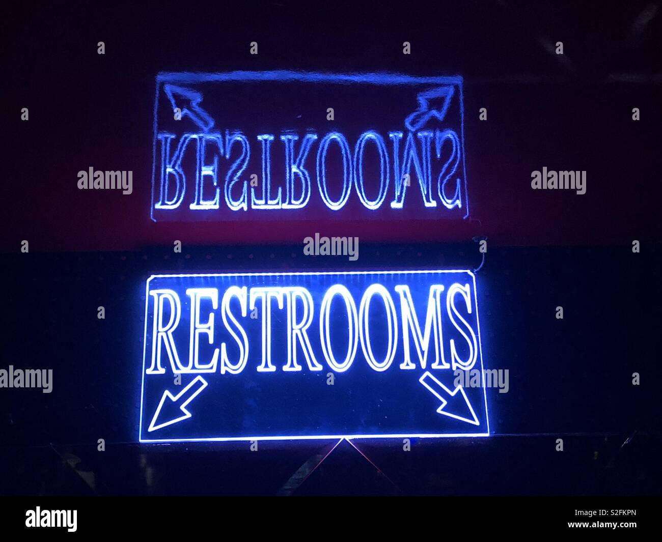 Neon restroom sign Stock Photo - Alamy
