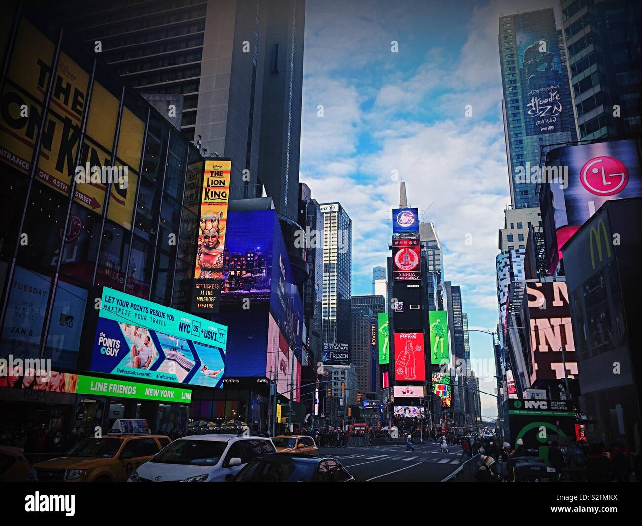 Automobile traffic and pedestrians in brightly lit Times Square, New York City, USA - Smartphone Captured Stock Image