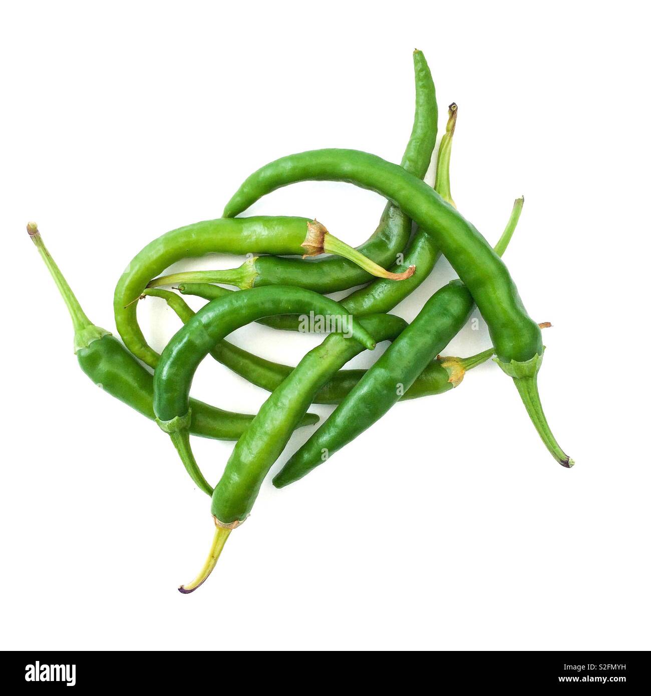 Green chili’s on white background Stock Photo